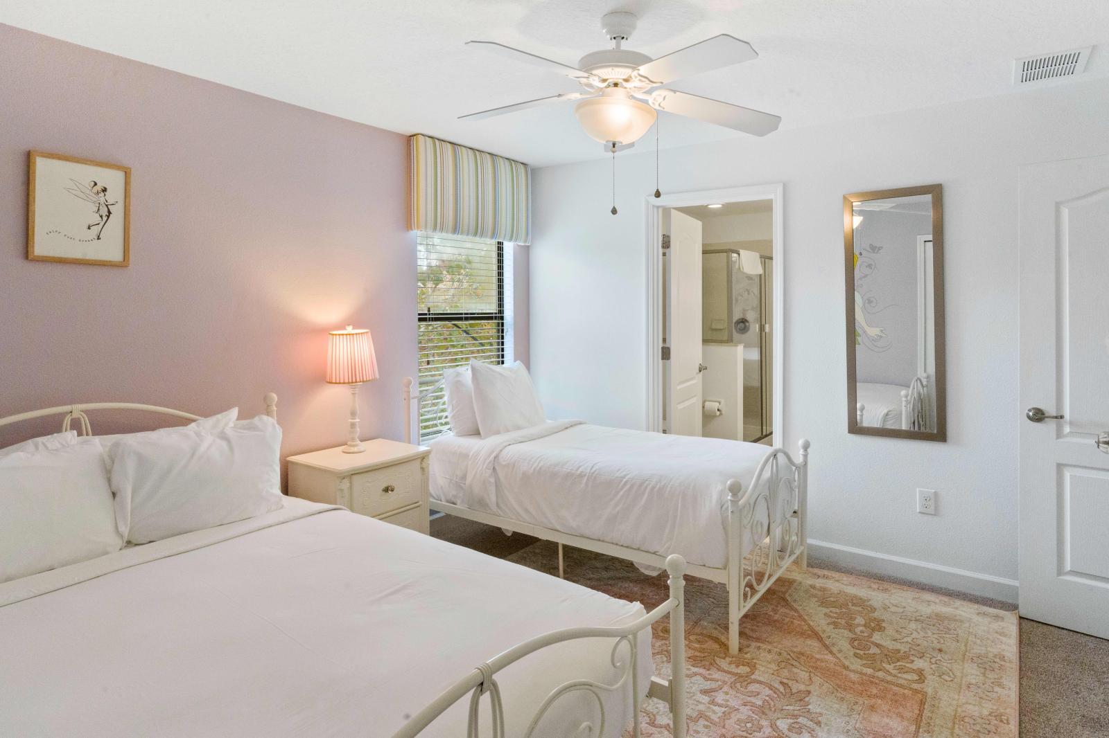 Dual Delight: Discover the convenience of our bedroom with two beds, creating a harmonious atmosphere for a peaceful night's rest.