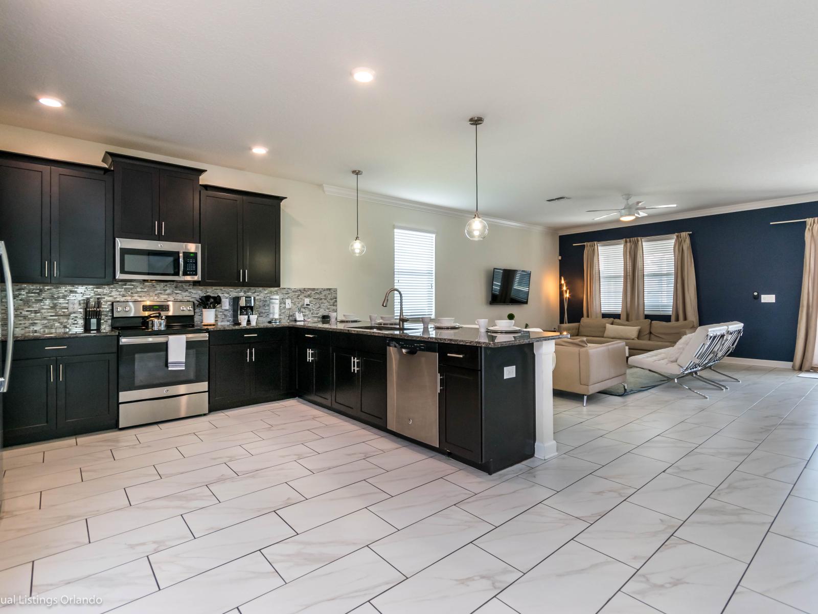 Pleasing Kitchen Area of the Home in Davenport Florida - The Kitchen has plenty of counter space and sleek cabinetry - Everything you need to prepare delicious meals  - Create unforgettable dining experiences