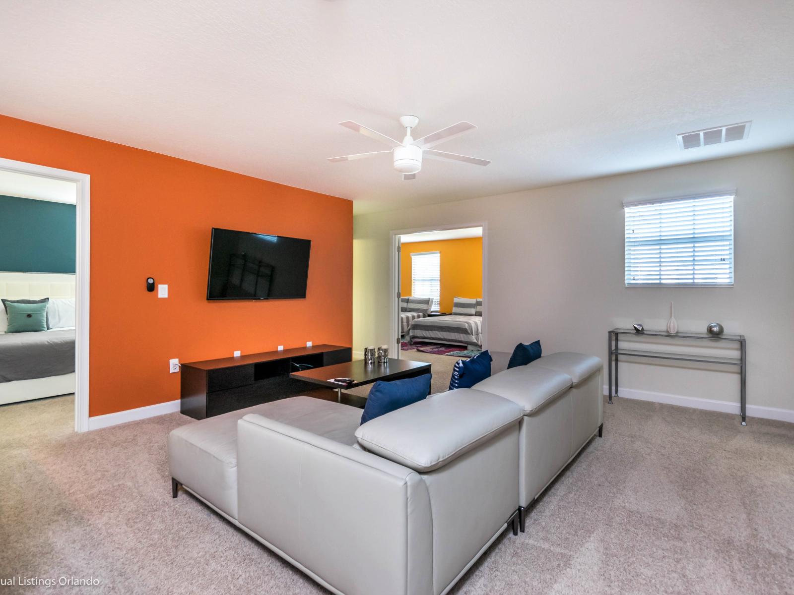 Stunning Living area of the Home in Davenport Florida - Offers an elevated entertainment experience - Comfortable seating conductive to socialization - Smart TV and Netflix