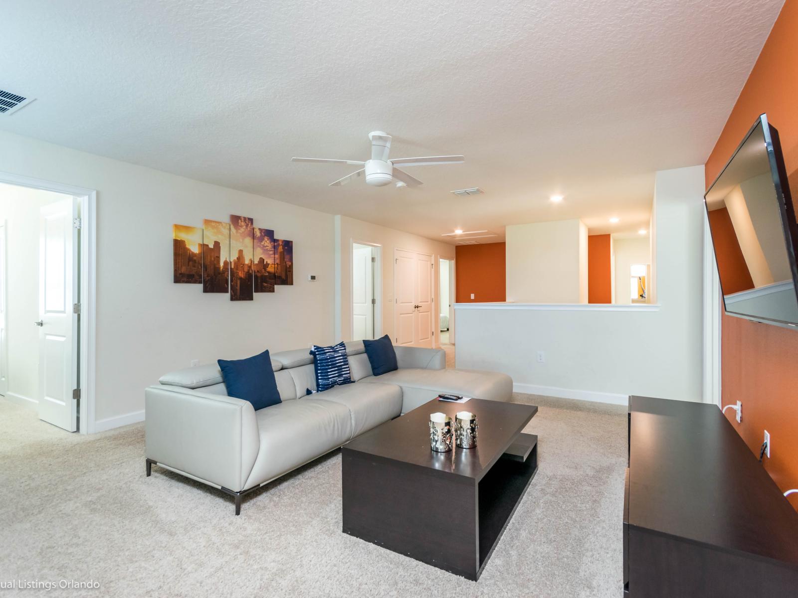 Swanky Living Area of the Home in Davenport Florida - Open and inviting living room features a comfortable couch  - Smart TV and Netflix - Lavish decor