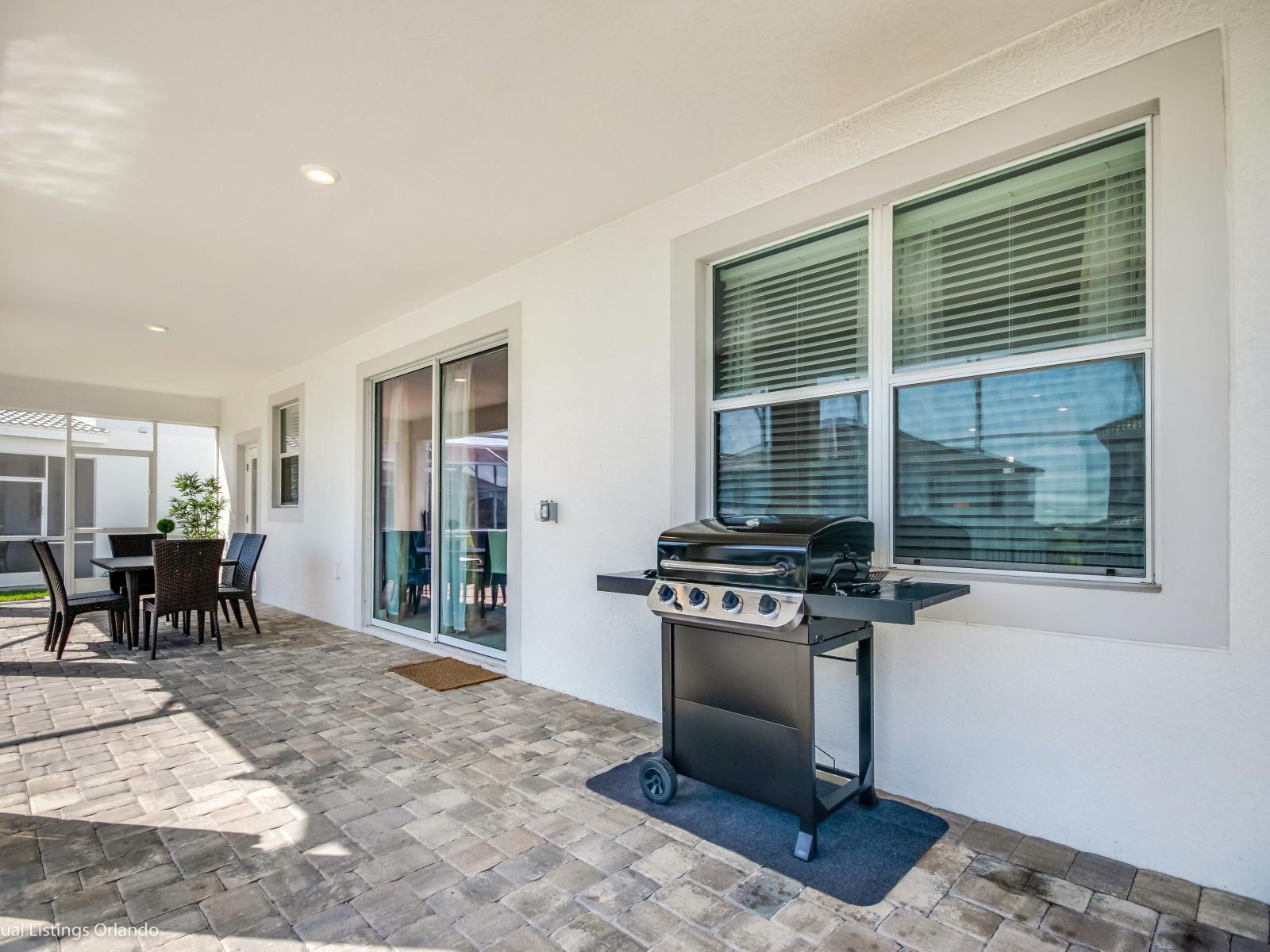 BBQ Area of the Home in Davenport Florida - An outdoor BBQ by your pool is the perfect spring and summer activity - Elevate your stay with our outdoor grilling space - The perfect spot to sizzle up some flavor under the open sky