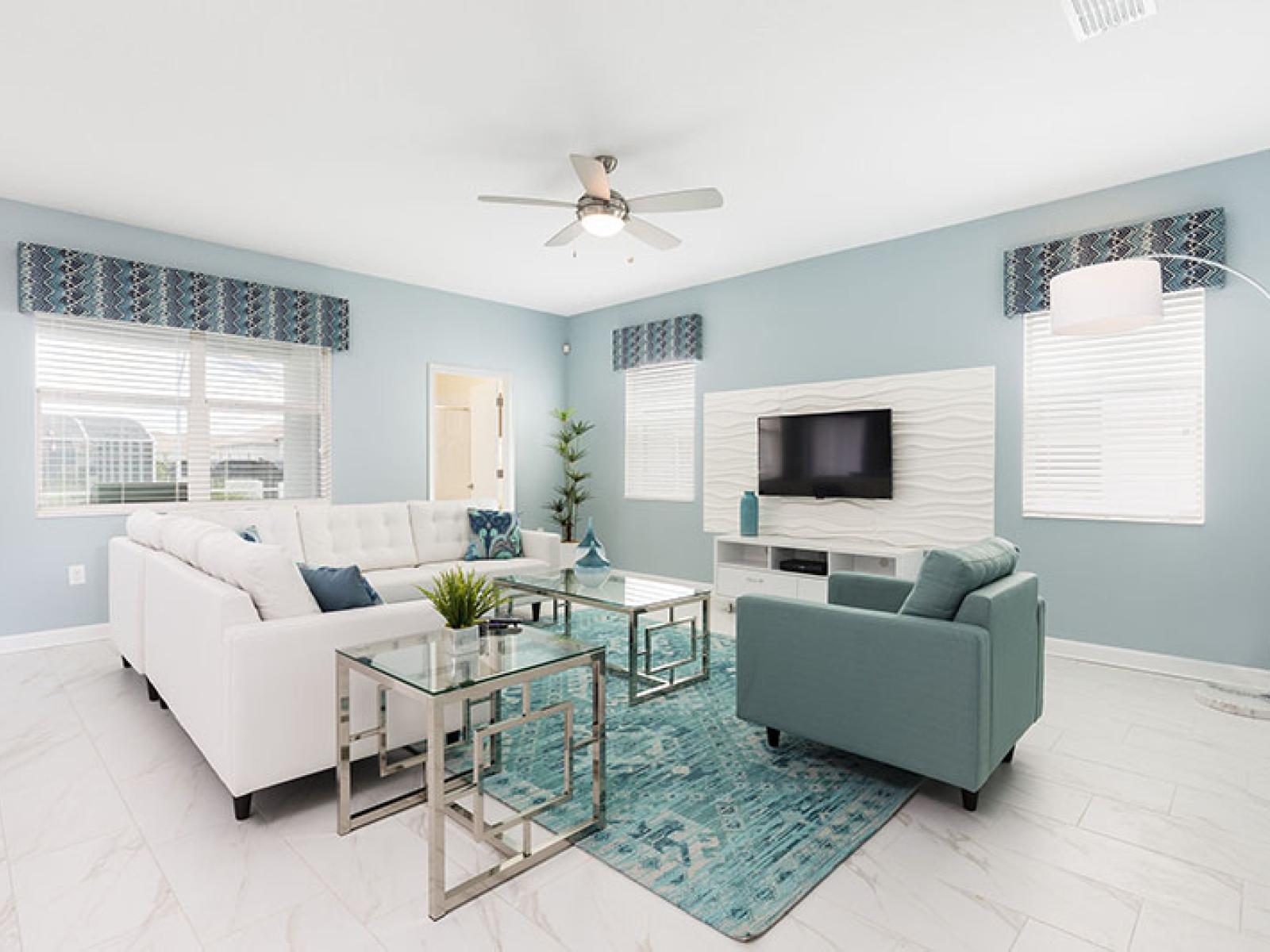 Elegant Living Area of the Home in Davenport Florida - Experience serenity in living area adorned with soft green hues - Inviting to unwind and relax in a soothing ambiance - Smart TV and Netflix - Comfy sofas