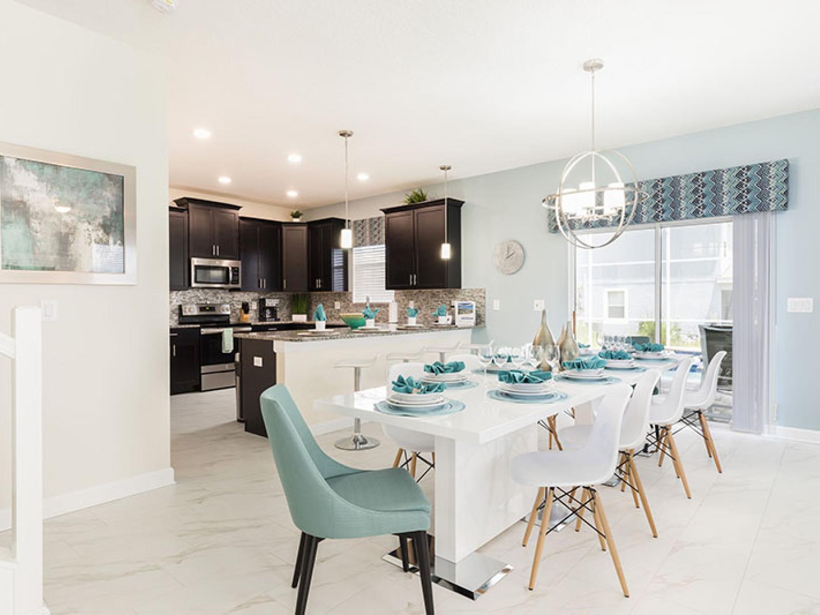 Bright Dining and Kitchen of the Home in Davenport Florida - Seamless connection to the kitchen for convenience - 8 Persons Dining - Elegantly curated decor that transforms spaces into havens of beauty