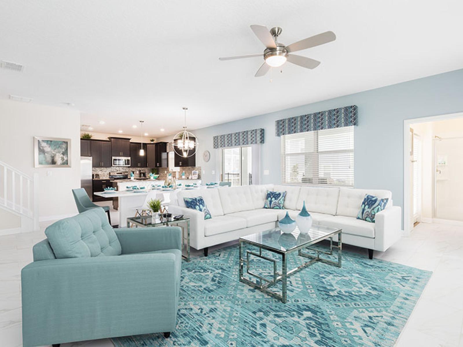 Spacious Living Area of the Home in Davenport Florida - Embrace comfort and warmth in cozy living area - Relaxation and serenity harmonize effortlessly - Well-chosen lighting fixtures adding both functionality and charm