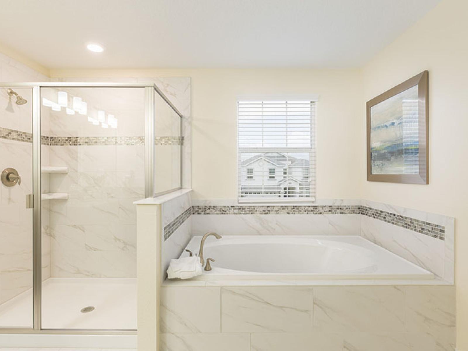 Luxurious Bathroom of the Home in Davenport Florida - Indulge in the ultimate bathing experience - Glass-enclosed Shower Area - Superb Bath-tub