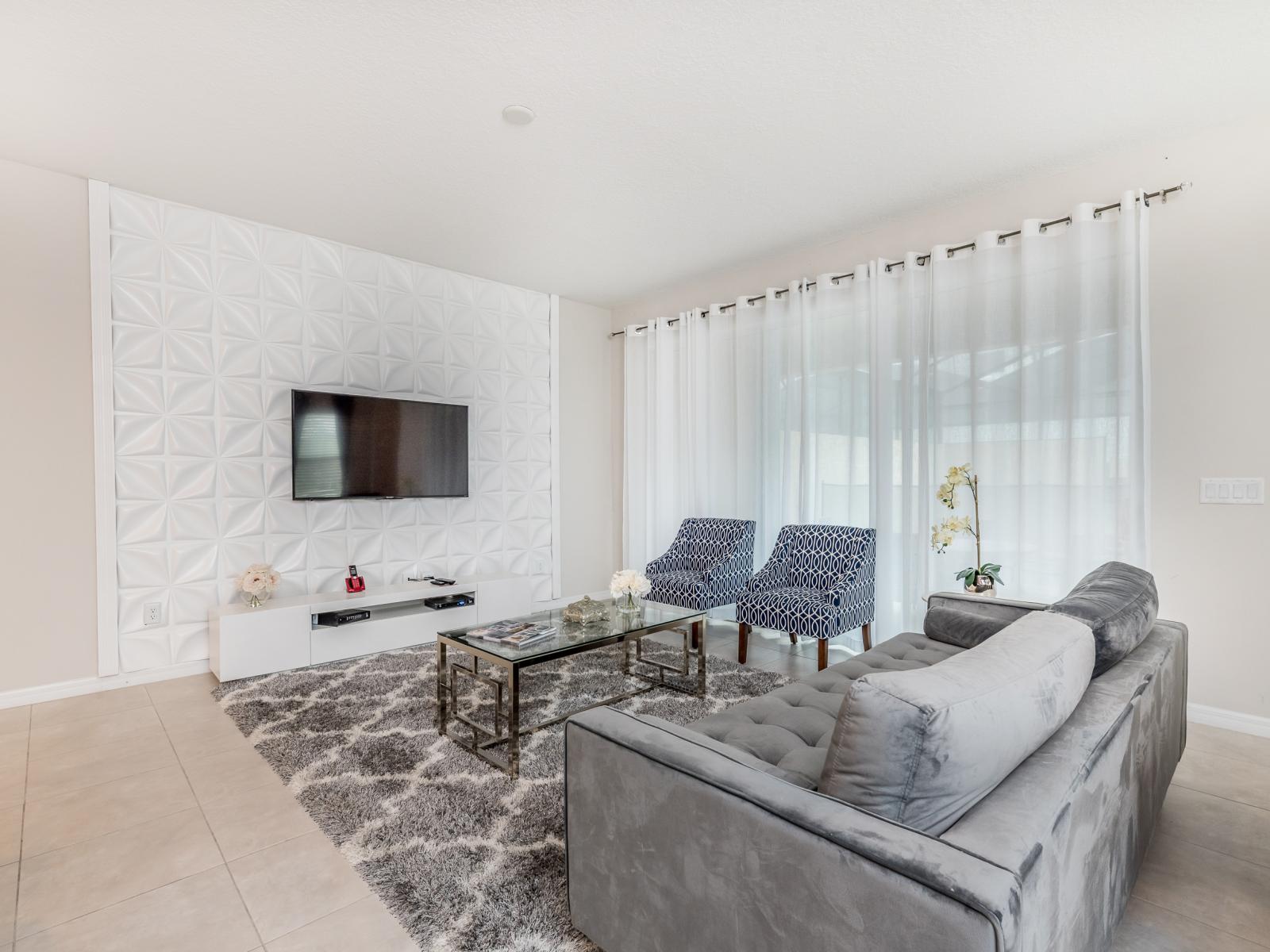 - Luxurious living area of the apartment in Kissimmee - Cosy sofas - Elegantly decored living area - Large bright windows of the living area with Mesmerizing views - Beautifully tile furnished floor - Availability of TV and Netflix