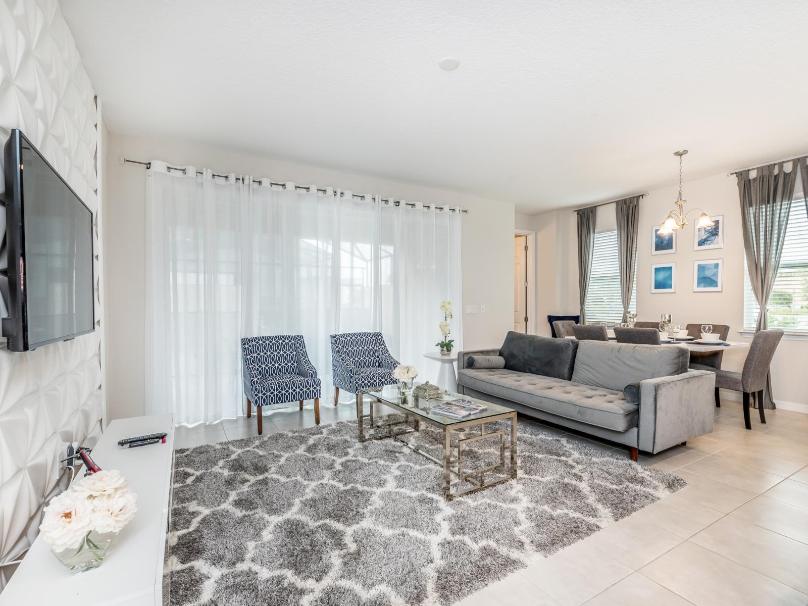 - Sublime living area of the apartment in Kissimmee - Cosy sofas - Elegantly decored living area - Large bright windows of the living area with Mesmerizing views - Beautifully tile furnished floor - Availability of TV and Netflix