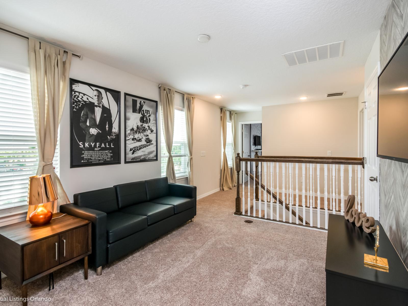 - Aesthetic living area of the apartment in Kissimmee - Cosy sofas - Elegantly decored living area - Large bright windows of the living area with Mesmerizing views - Beautifully furnished floor - Availability of TV and Netflix