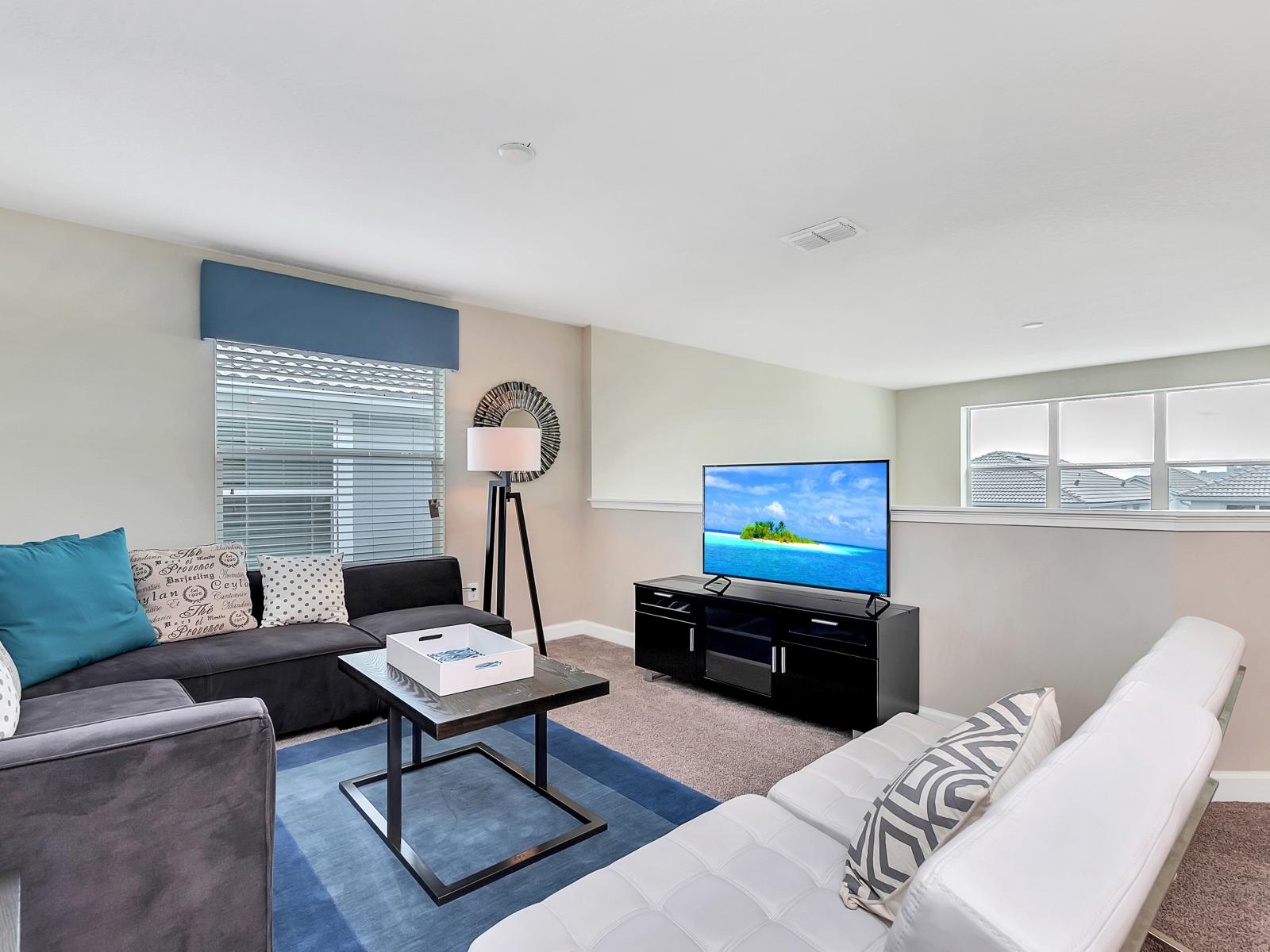 Swish Living Area of the Home in Davenport Florida - Elegantly decorated space with a neutral color palette for a timeless appeal - Smart TV and Netflix - Harmonious color scheme with pops of accent colors for visual interest