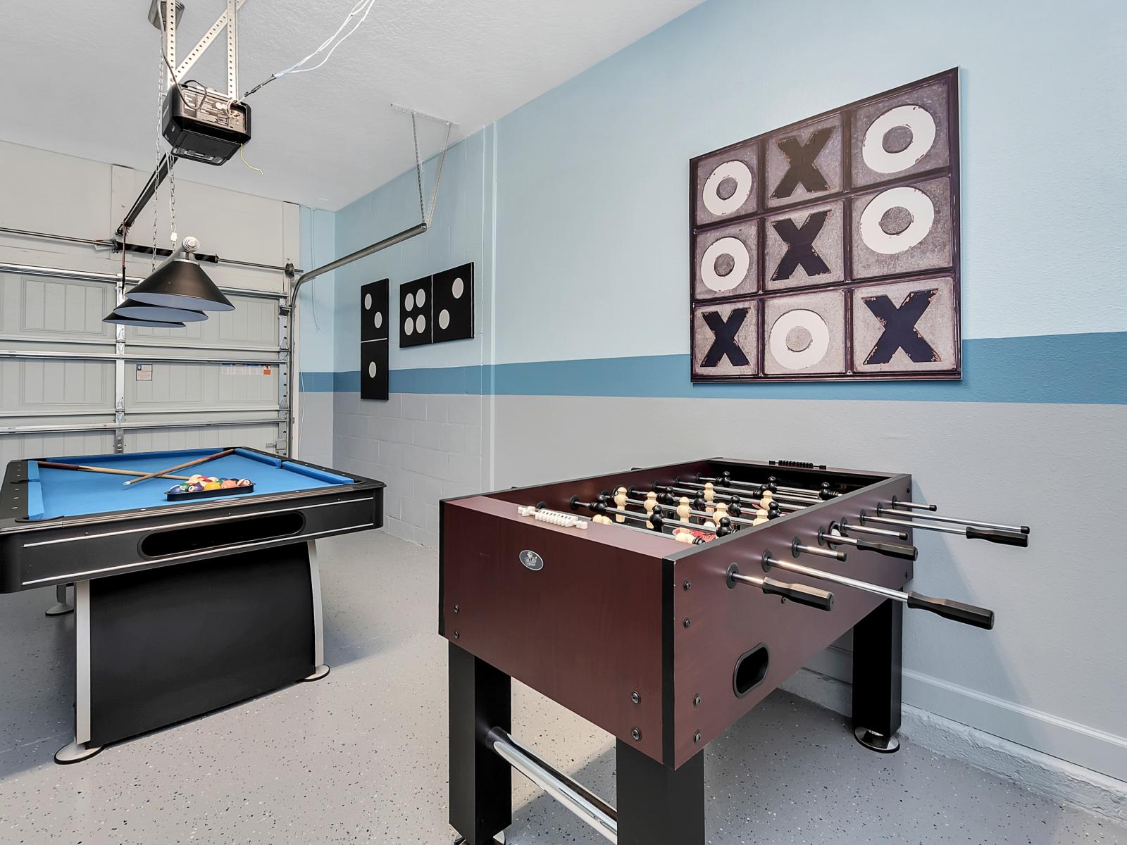 Fun Family Room of the Home in Davenport Florida - The family room showcases a pool table, foosball table, and life-size tic- tac toe - You can have the time of your life without ever having to leave this house