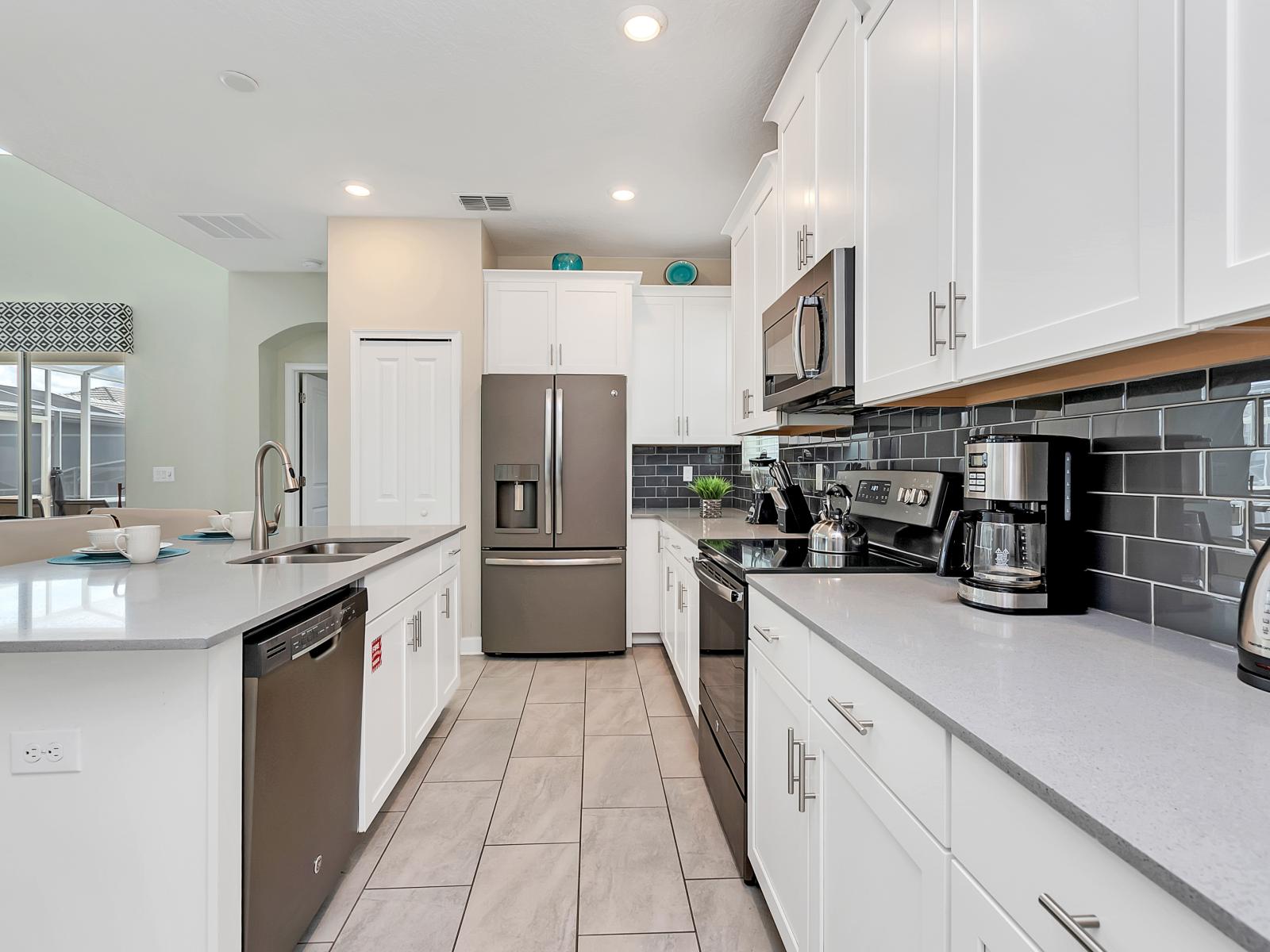 Sleek Kitchen of the Home in Davenport Florida - Fully-equipped kitchen  - A functional layout and ergonomic design for ease of use. - A stylish space that's as practical as it is beautiful