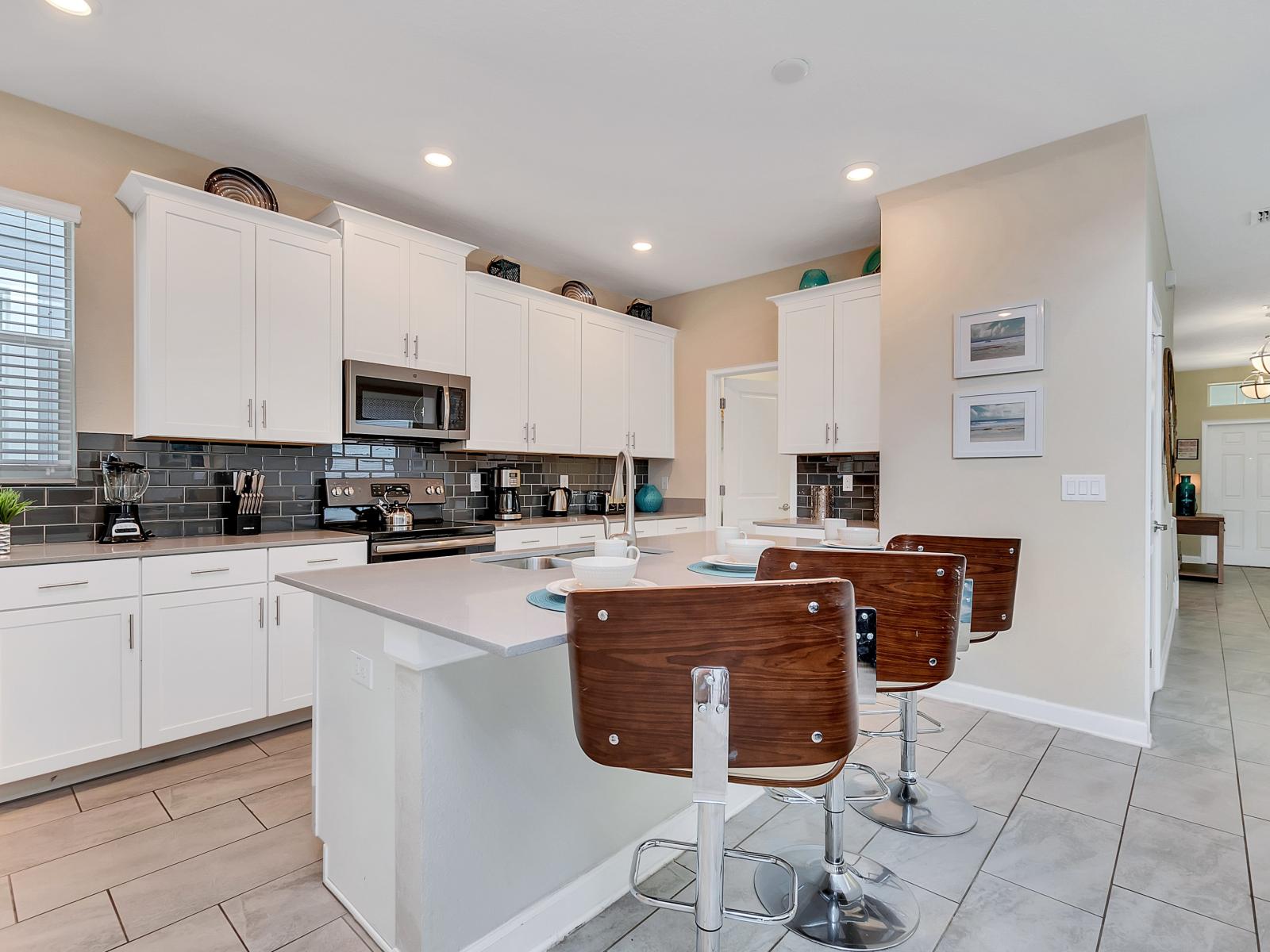 Sleek Kitchen of the Home in Davenport Florida - A chef's dream space where cooking becomes a pleasure - Step into our chef-inspired kitchen - Top-of-the-line appliances and premium fixtures for culinary excellence49