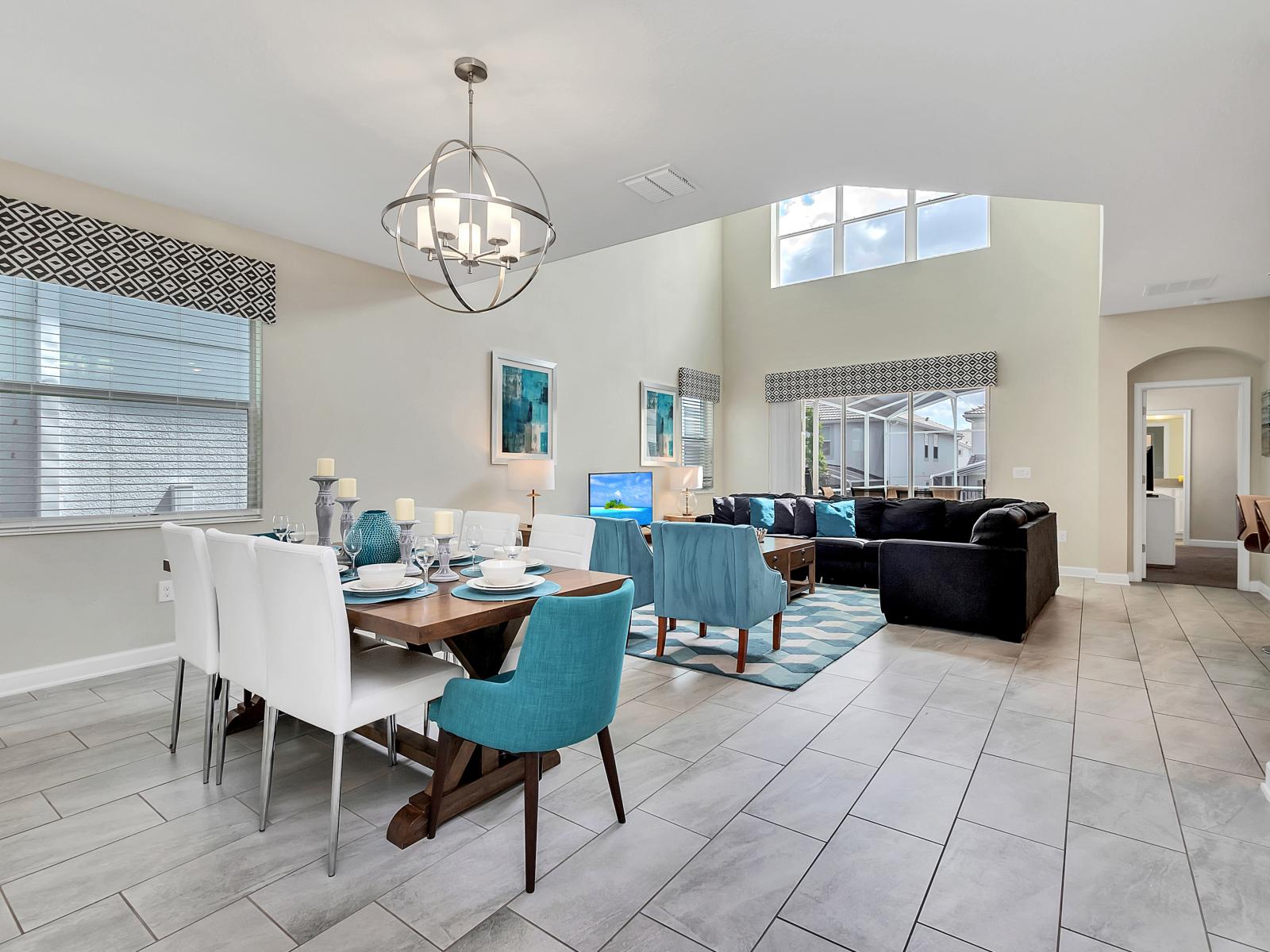 Chic Dining Area of the Home in Davenport Florida - Dining space, a stylish setting - Quality materials, such as a sleek dining table and comfortable chairs - Beautiful Chandelier  - 8 Persons Dining