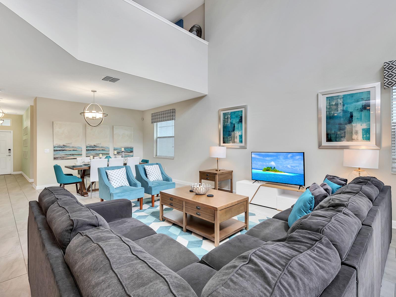 Amazing Living Area of the Home in Davenport Florida - Living Area welcomes you with a plush, comfy couch - Inviting relaxation and leisurely moments - High Ceiling creating sense of spaciousness