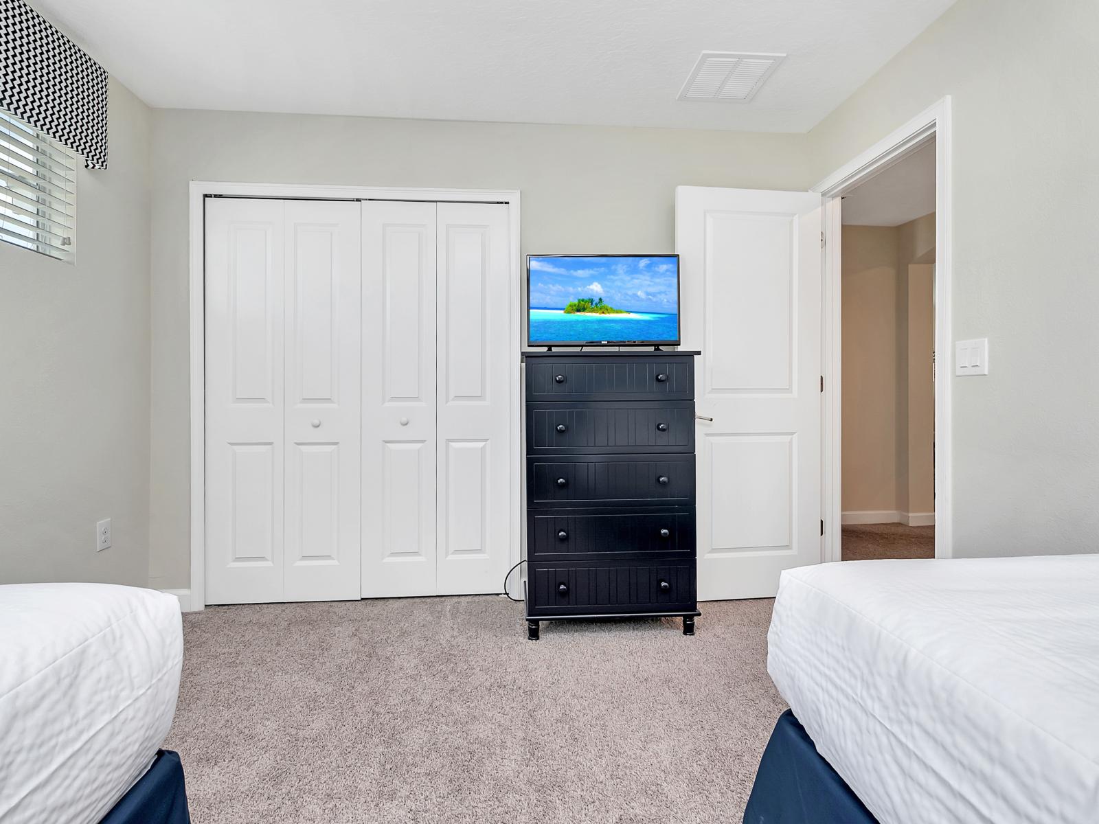 Picturesque Bedroom of the Home in Davenport Florida - Bright and airy bedroom with large windows for natural illumination - Smart TV and Netflix - Thoughtfully designed bedroom featuring functional and stylish furniture - Comfy single Beds