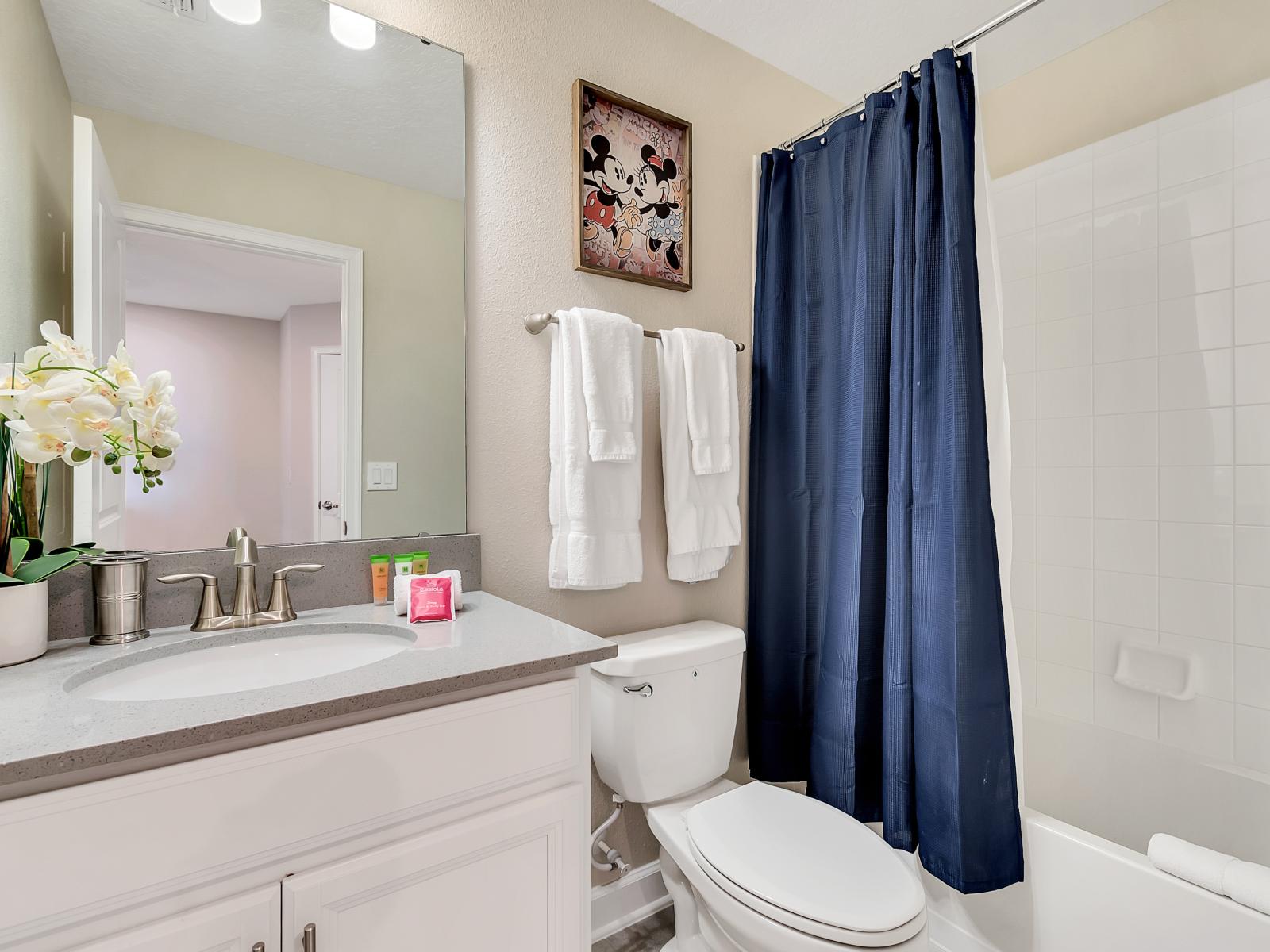 Classy Bathroom of the Home in Davenport Florida - Neat and clean toilet seat - Great lighting - Beautiful Vanity with large size wall mirror