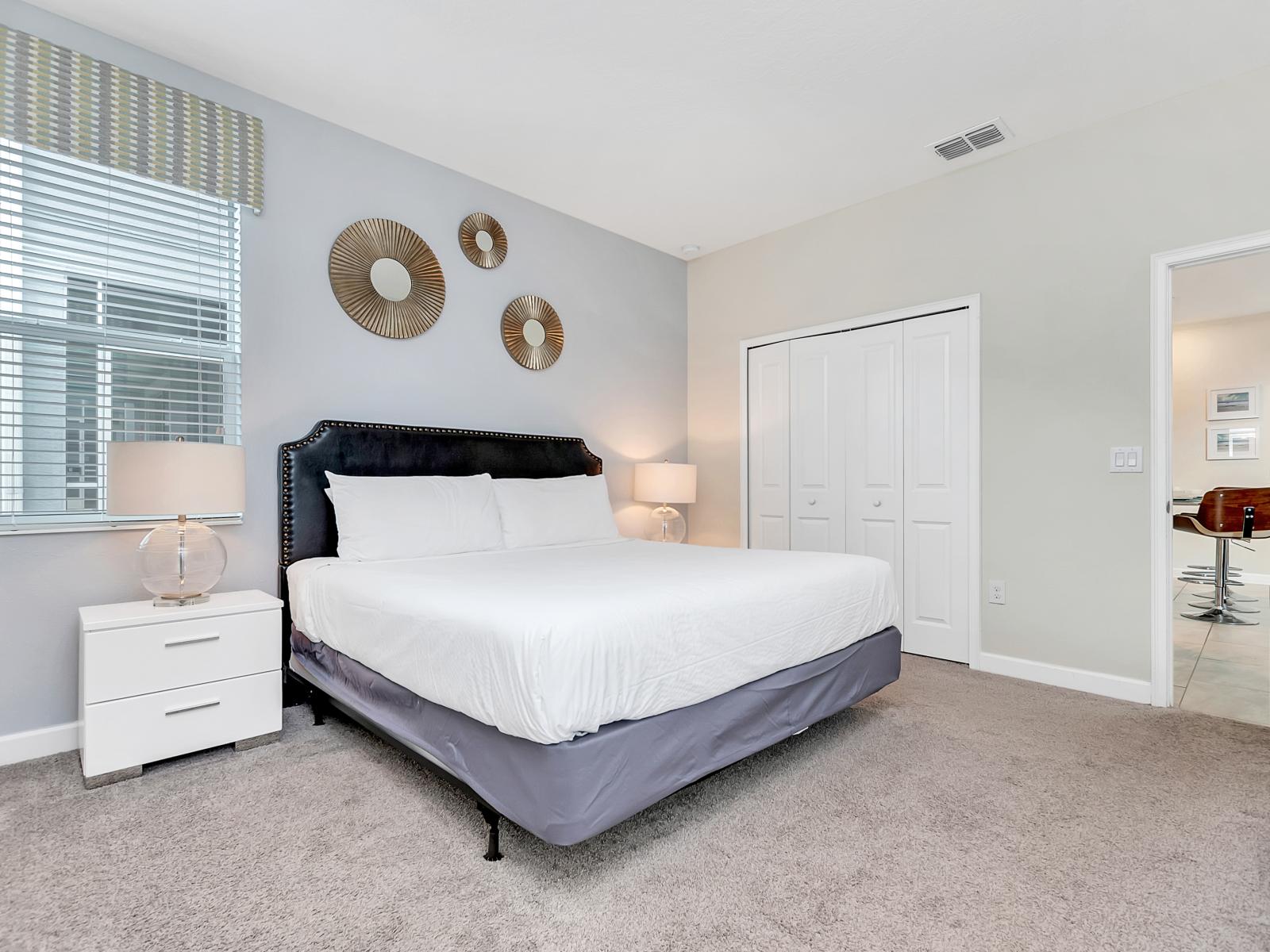 Tranquil Bedroom of the Home in Davenport Florida - Comfy Double Size bed - Luxurious bedding for a restful night's sleep - Harmonious color palette creating a soothing atmosphere - Elegant side lamps