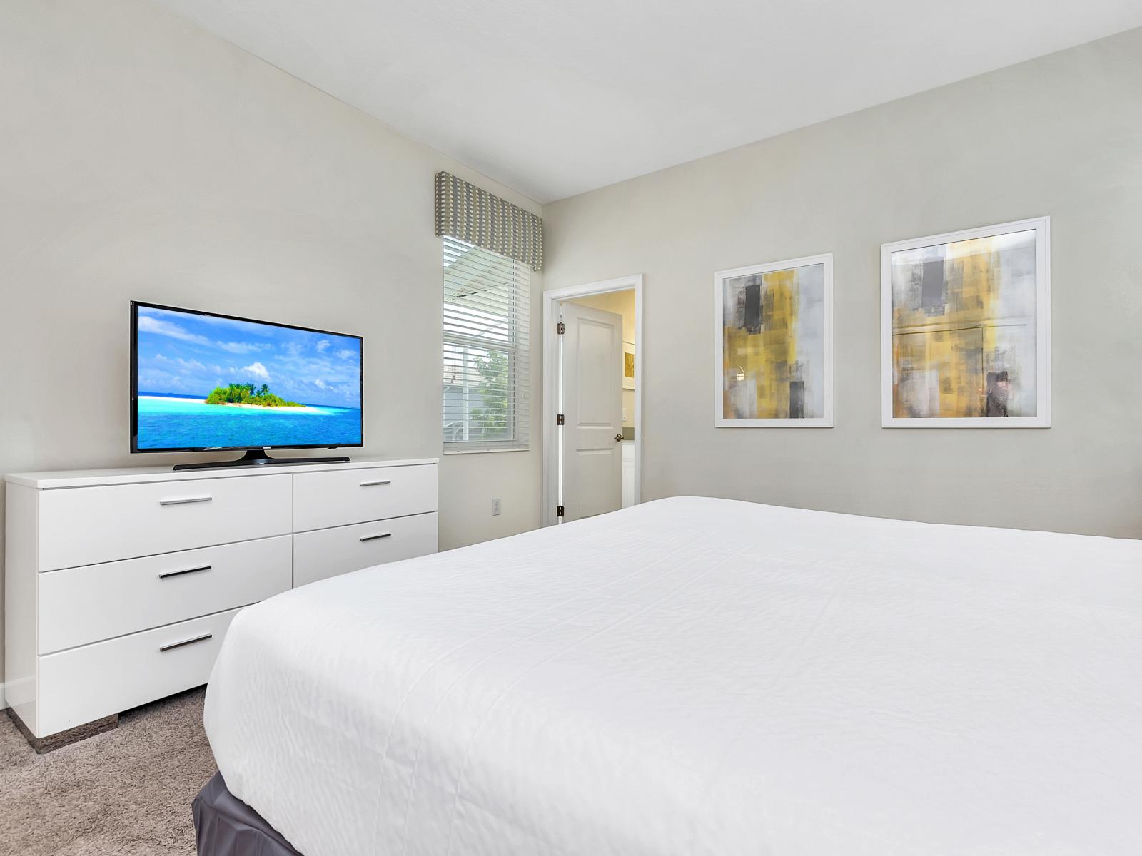 Relaxing Bedroom of the Home in Davenport Florida - Indulge in regal relaxation - Minimalistic Approach giving clean space to relax - Bedroom boasts a double bed - Smart TV and Netflix