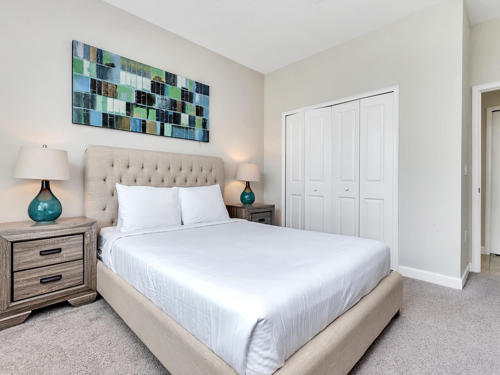 Comfy Bedroom of the Home in Davenport Florida - Soft, neutral tones and calming decor - Cozy textiles and plush bedding for a restful night's sleep - A peaceful ambiance perfect for relaxation and rejuvenation