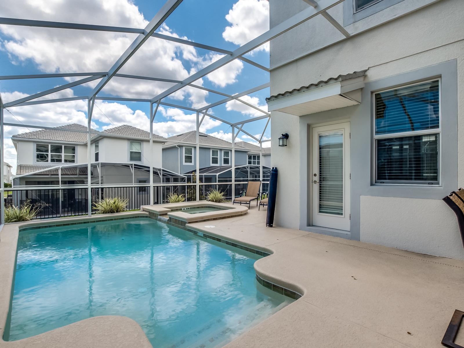 Amazing Private Pool of the Home in Davenport Florida - Sparkling waters and swaying palm trees creating a serene setting - Comfortable seating areas for enjoying cocktails with friends