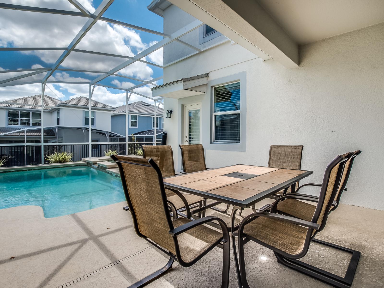 Splendid Private Pool of the Home in Davenport Florida - This magnificent outdoor dining area provides an opportunity for al fresco meals  - Relaxed gatherings with pool views