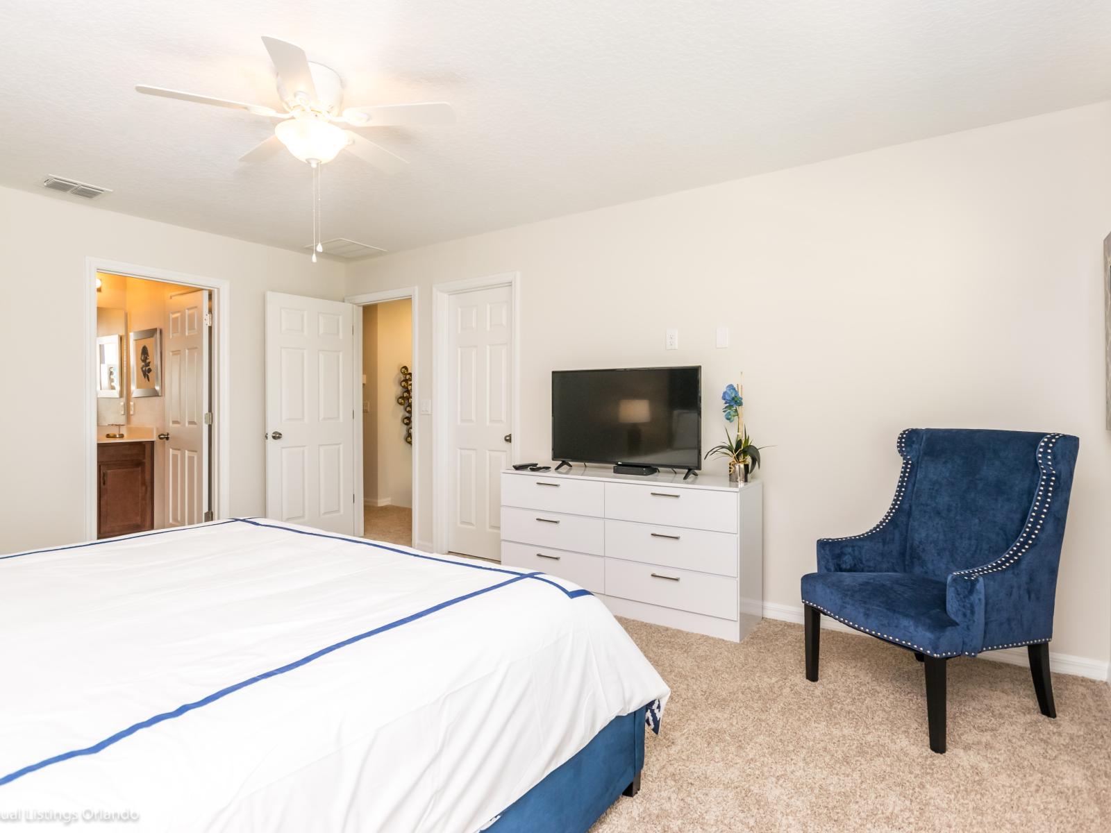 Experience unparalleled comfort and luxury in the main bedroom featuring a spacious king-sized bed.