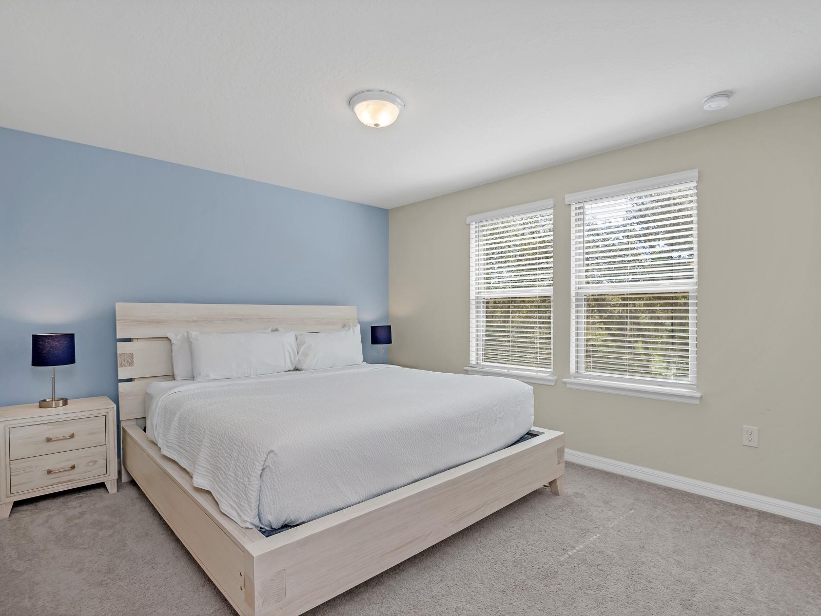 Step into this serene bedroom, where every detail whispers of relaxation and rejuvenation. A peaceful retreat, inviting you to unwind and embrace the beauty of quiet moments.