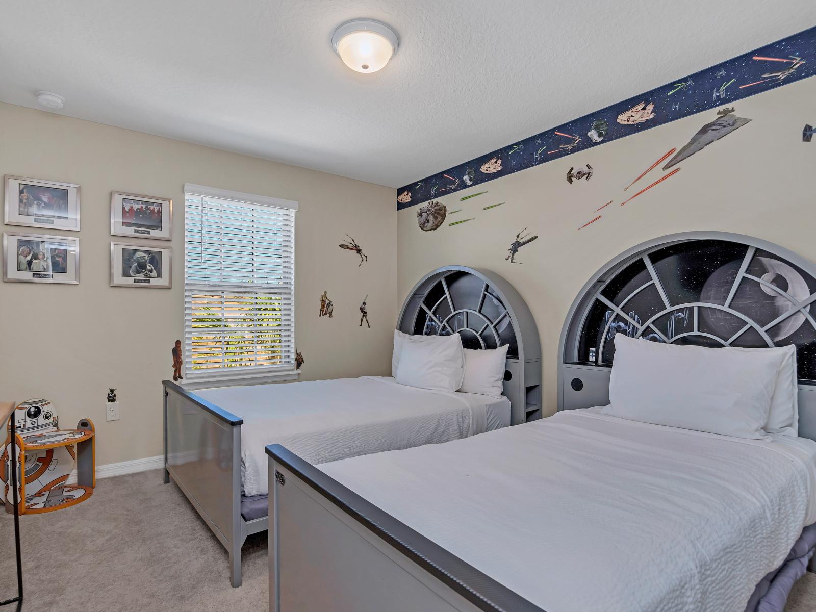 Galactic Adventure Awaits: Step into a galaxy far, far away with this Star Wars themed room, where every corner is infused with the magic of the Force, inviting young and old alike to embark on epic adventures and dream among the stars.