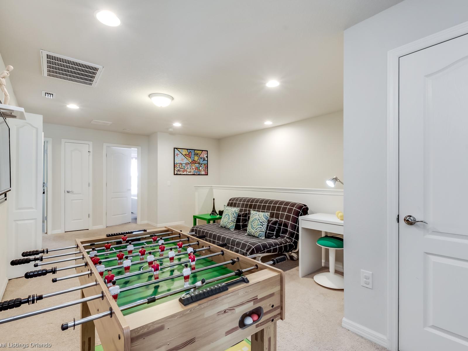 Level up your vacation experience at apartment Game Room fun for all ages! - From classic arcade games to modern consoles, our game room at apartment has it all. - Create unforgettable memories with friends in our spacious game room.