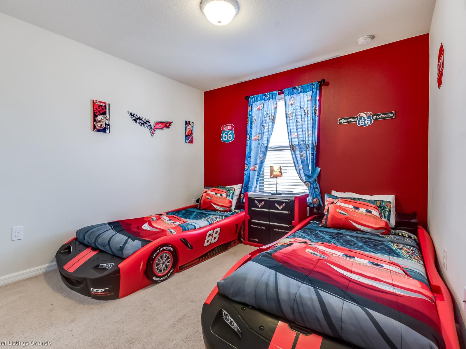 Experience the magic of Disney with our Cars-themed room, complete with two cozy single beds. - Stunning wardrobe with sufficient space - Enjoy the Availability of Smart Tv and Netflix - Indulge in mesmerizing views from the windows of the room