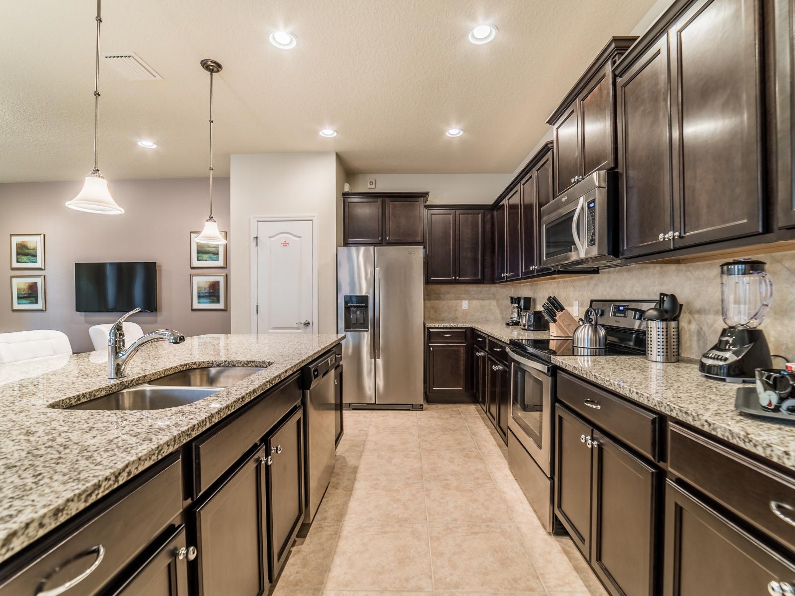 Clean Kitchen of the Townhouse in Kissimmee Florida - Full equipped - Kitchen with stainless steel appliances - Modern style featuring sleek lines and minimalist beauty