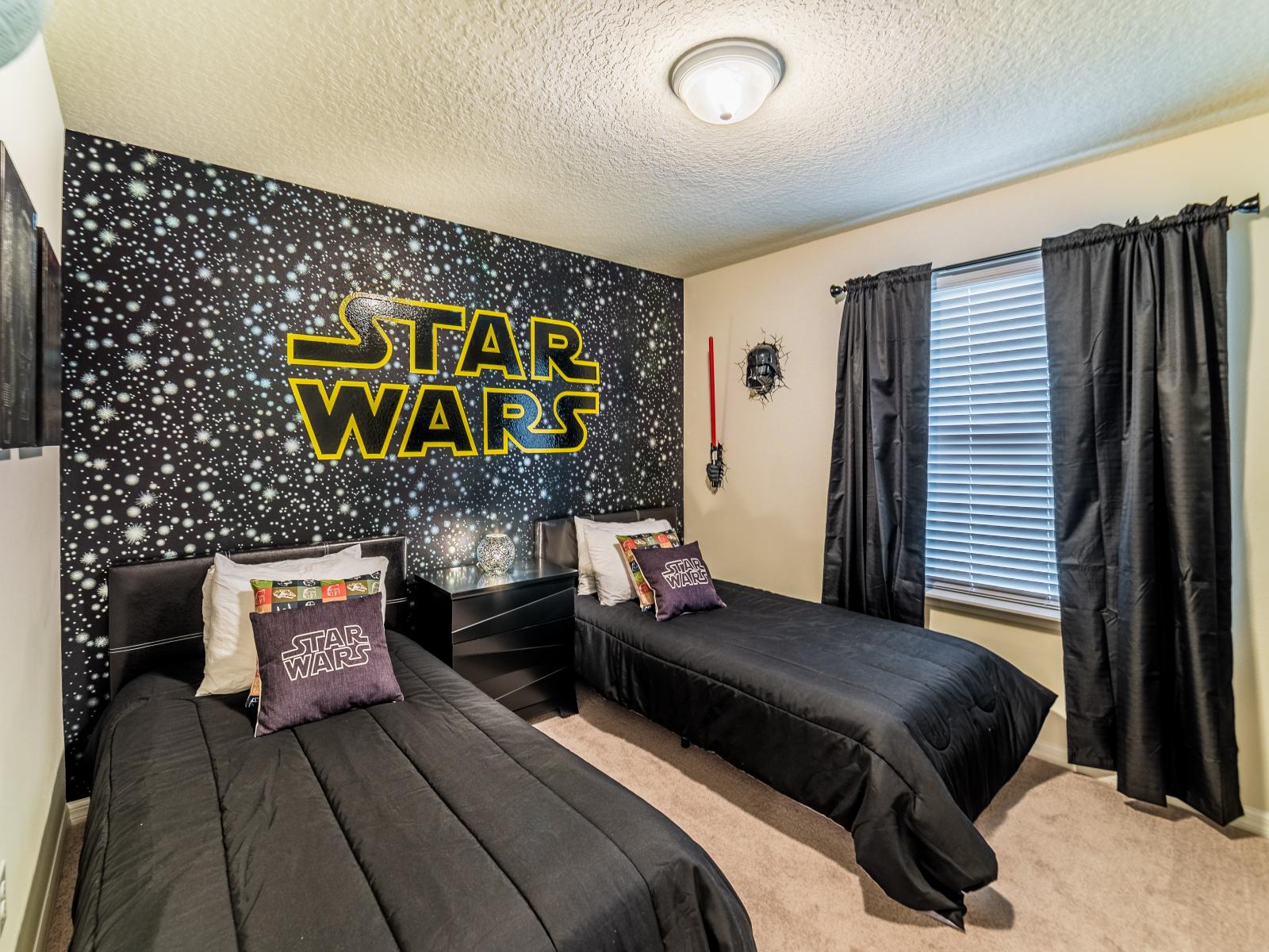 Step into a galaxy far away with this Star Wars themed room - Immerse in the force of Star Wars sanctuary - Unleash Your Inner Jedi stay in Our Star Wars themed room - Cozy single beds with Star Wars cushions