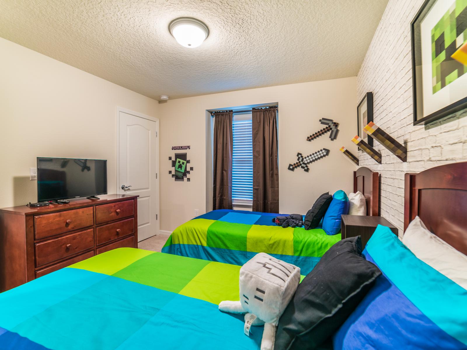 Immerse yourself in the world of creativity and adventure with this Minecraft-themed bedroom. From blocky decor to vibrant colors, every detail is a nod to the beloved game, turning bedtime into a pixelated journey of imagination.