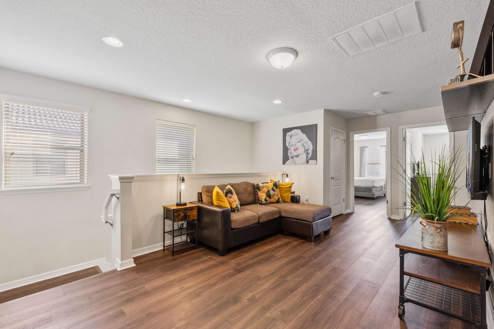 Loft area perfect space with smart tv and comfortable sofa