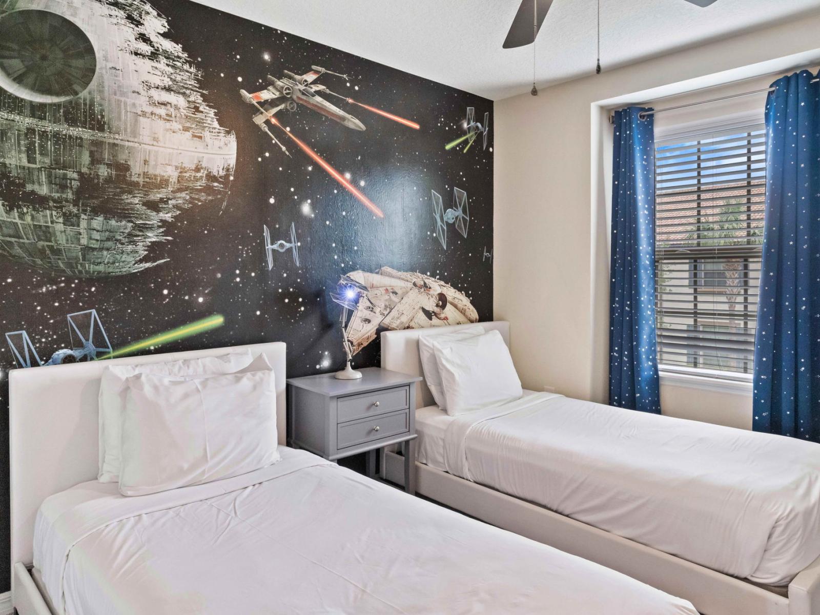 Step into the Star Wars-themed kids' room, complete with two twin beds and a ceiling fan. Here, young Jedi and rebels find their sanctuary, where imagination thrives and dreams take flight in a galaxy far, far away.