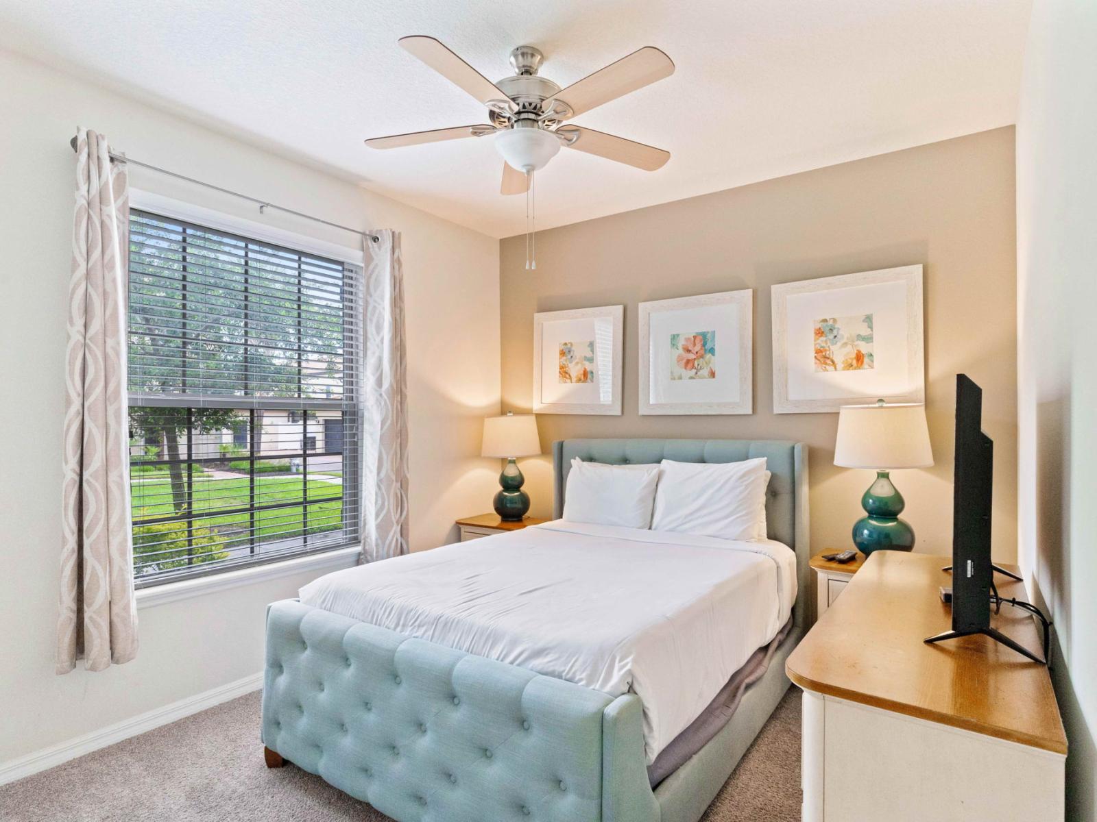 Bedroom 1 offers a regal escape with its queen size bed and comforting ceiling fan, where relaxation reigns supreme in a haven designed for tranquility and restful slumber.