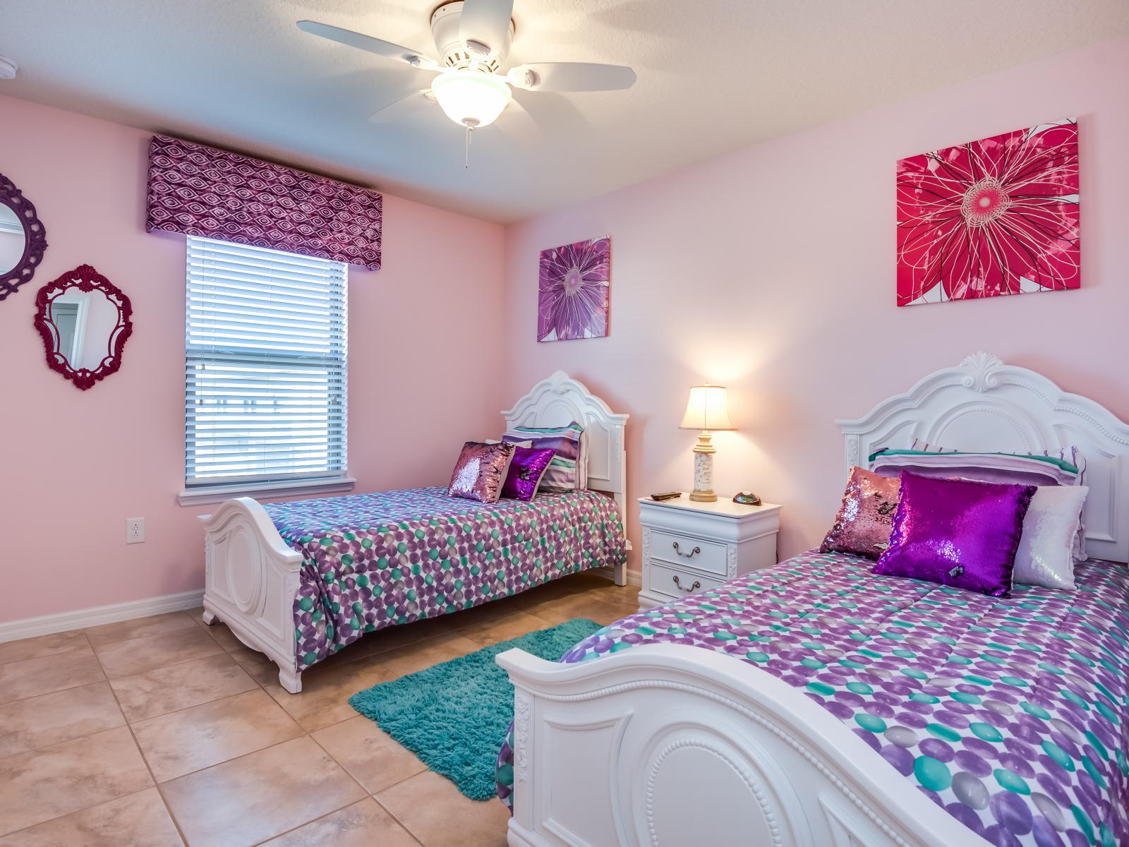 Charming Retreat: This bedroom for girls with two beds radiates charm and warmth, offering a cozy haven where shared dreams and laughter intertwine, creating cherished memories in a space designed for friendship and fun.