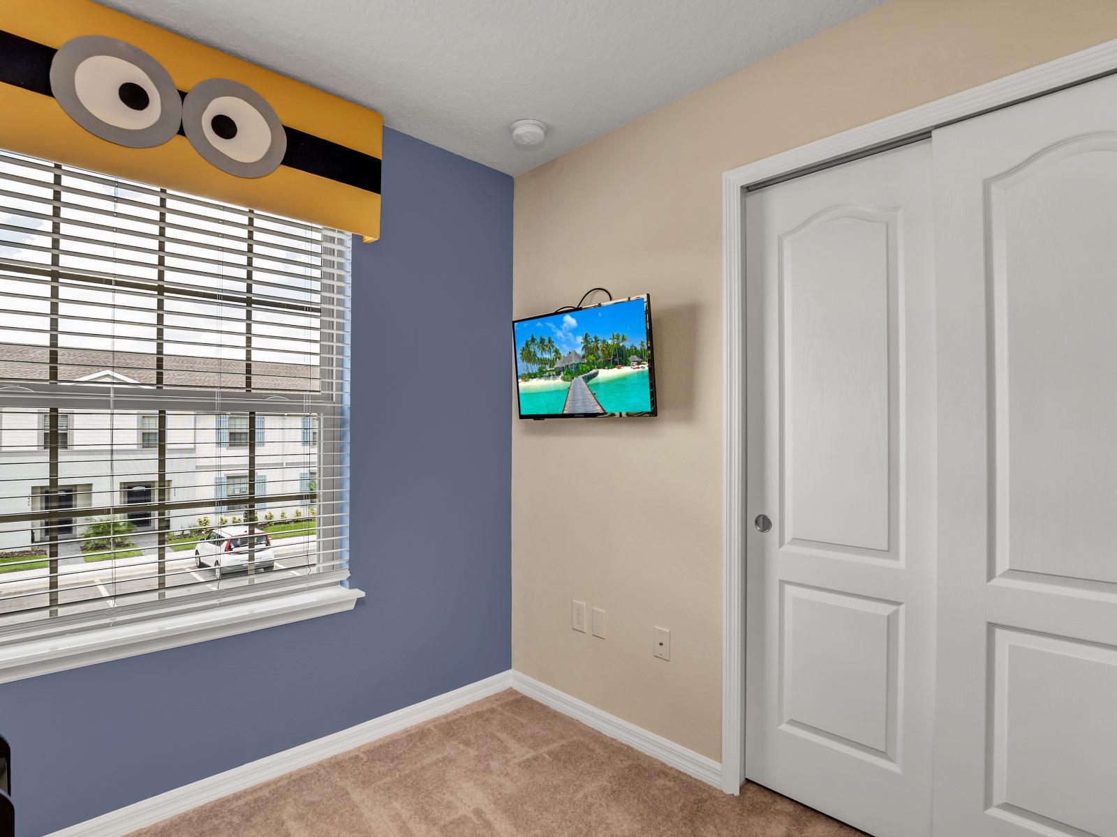 Minion themed kids room with single over double bunk bed