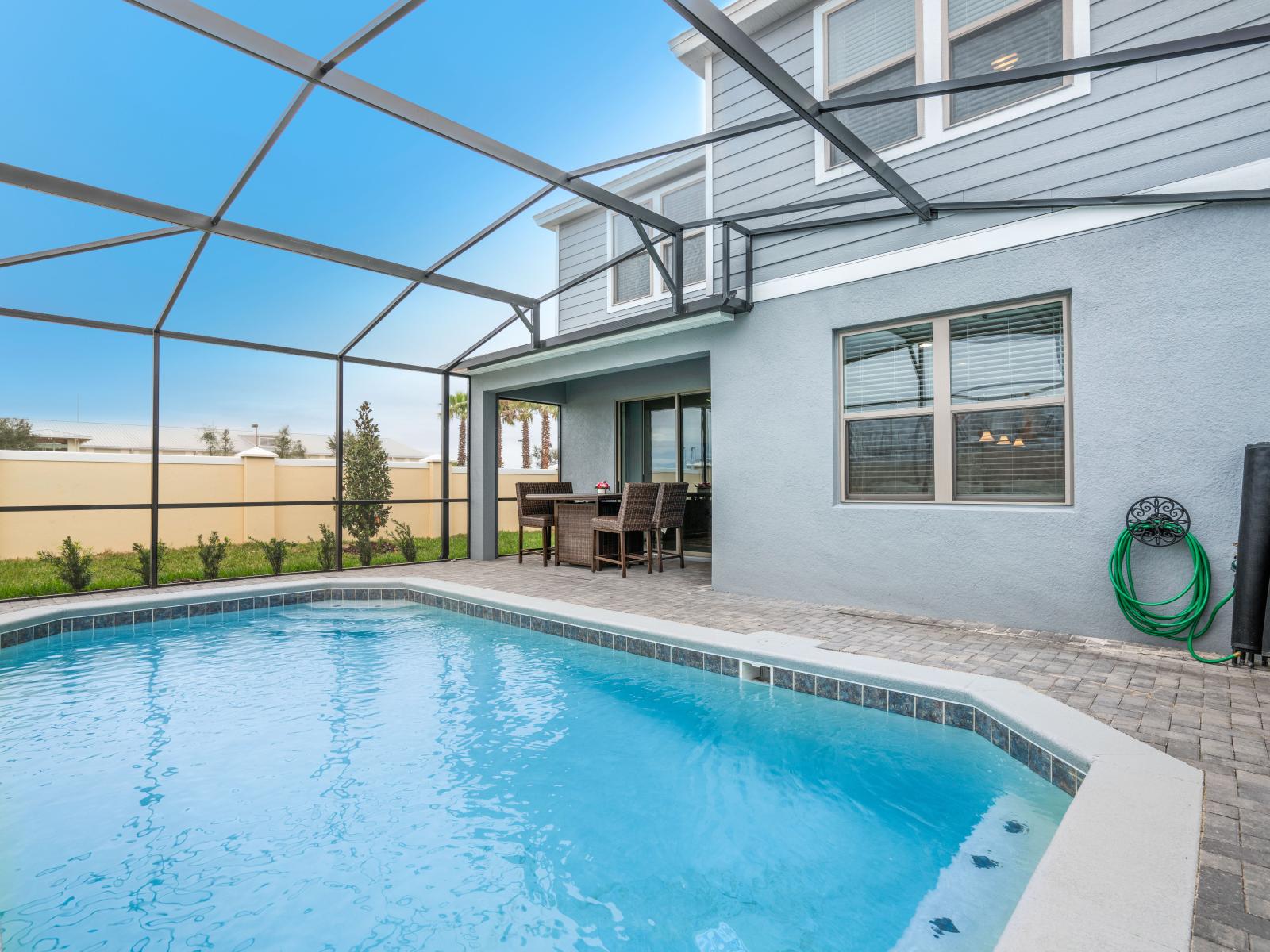 Splendid Shared Pool of the Apartment in Kissimmee - Cosy beach chairs available - Dive into refreshing poolside escape - Immerse yourself in the cool elegance of our pool - Experience ultimate relaxation in our poolside paradise