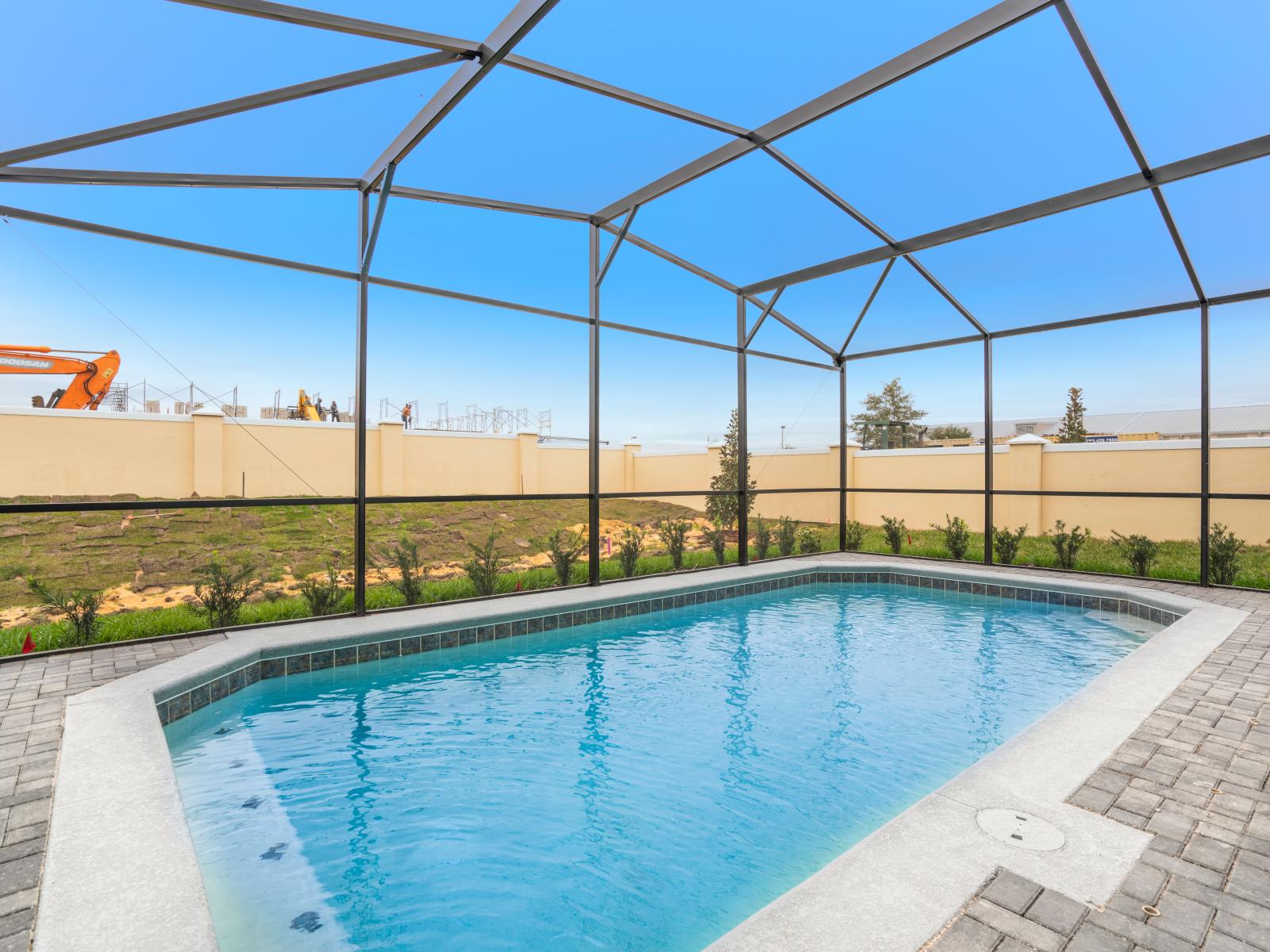 Spectacular Shared Pool of the Apartment in Kissimmee - Cosy beach chairs available - Dive into refreshing poolside escape - Immerse yourself in the cool elegance of our pool - Experience ultimate relaxation in our poolside paradise