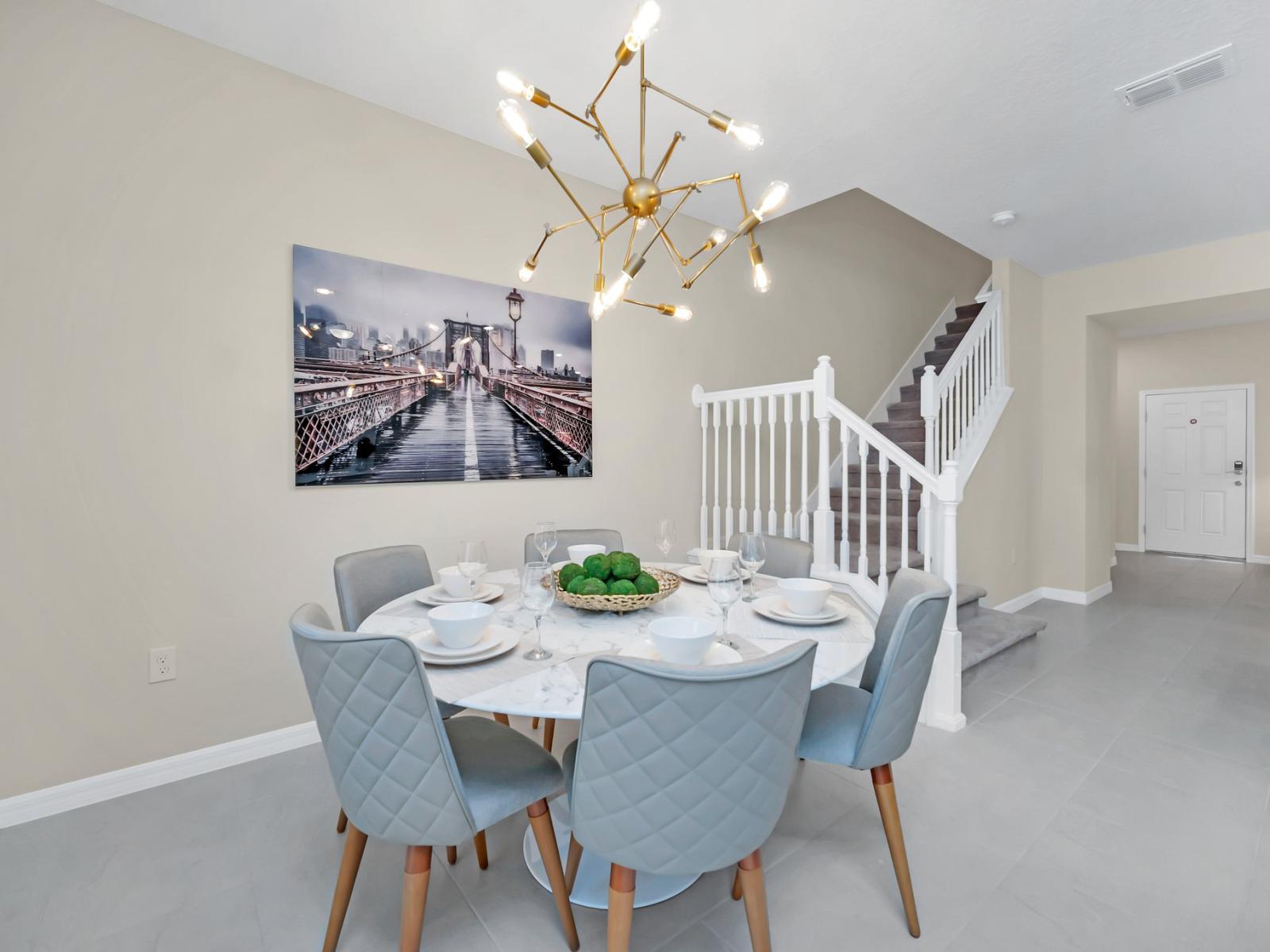 Stunning six seater dining table of the townhouse in Polk County, Florida - Understated elegance in décor, ensuring the spotlight shines on the dining experience - Magnificent chandelier commanding admiration