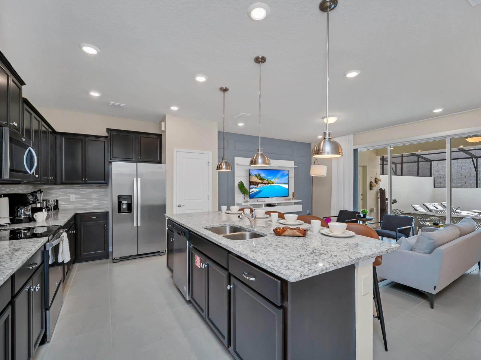 Sip, snack, and socialize in our chic open kitchen with countertop seating, seamlessly connected to the living room.