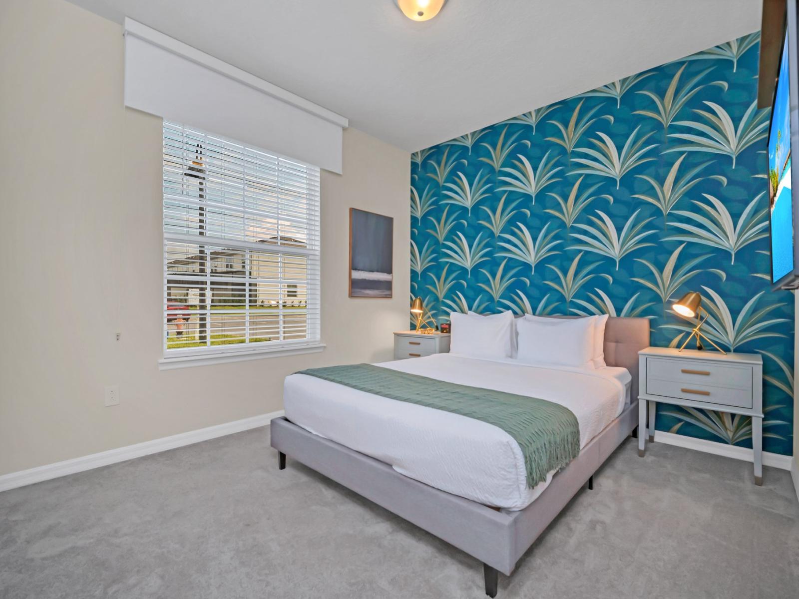 Deluxe Bedroom of the townhouse in Polk County, Florida - Vibrant colors with minimalistic décor - Sophisticated bedside lamps - Roomy bedroom with generous windows to invite natural light. - Smart TV with Netflix