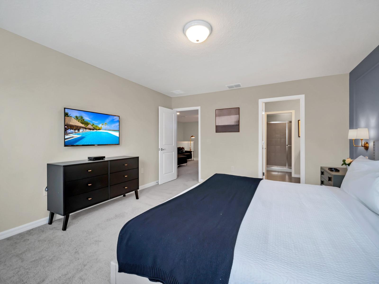 Sophisticated bedroom of the townhouse in Polk County, Florida - Indulgent bed dressed in immaculate, pristine linens and luxuriously soft pillows - Attached bathroom  - Smart TV with Netflix