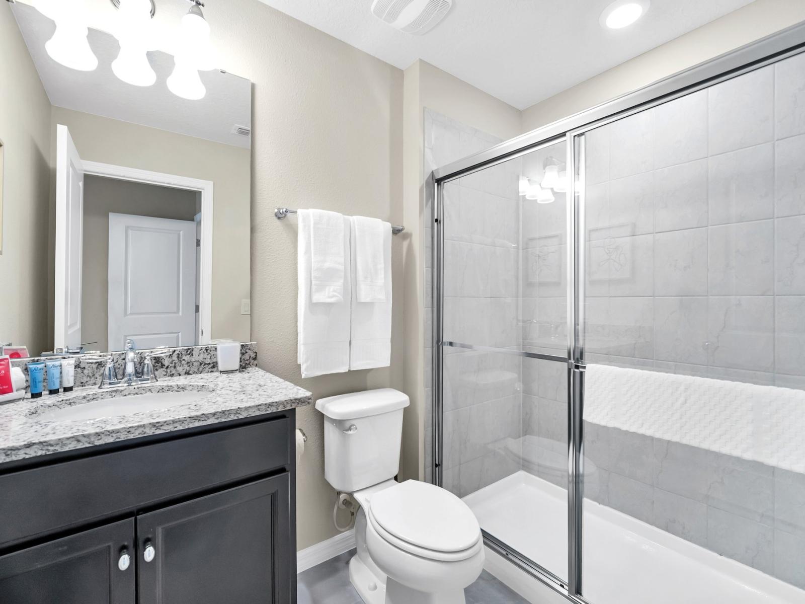 Step into sophistication: Our sleek bathroom exudes modern elegance.