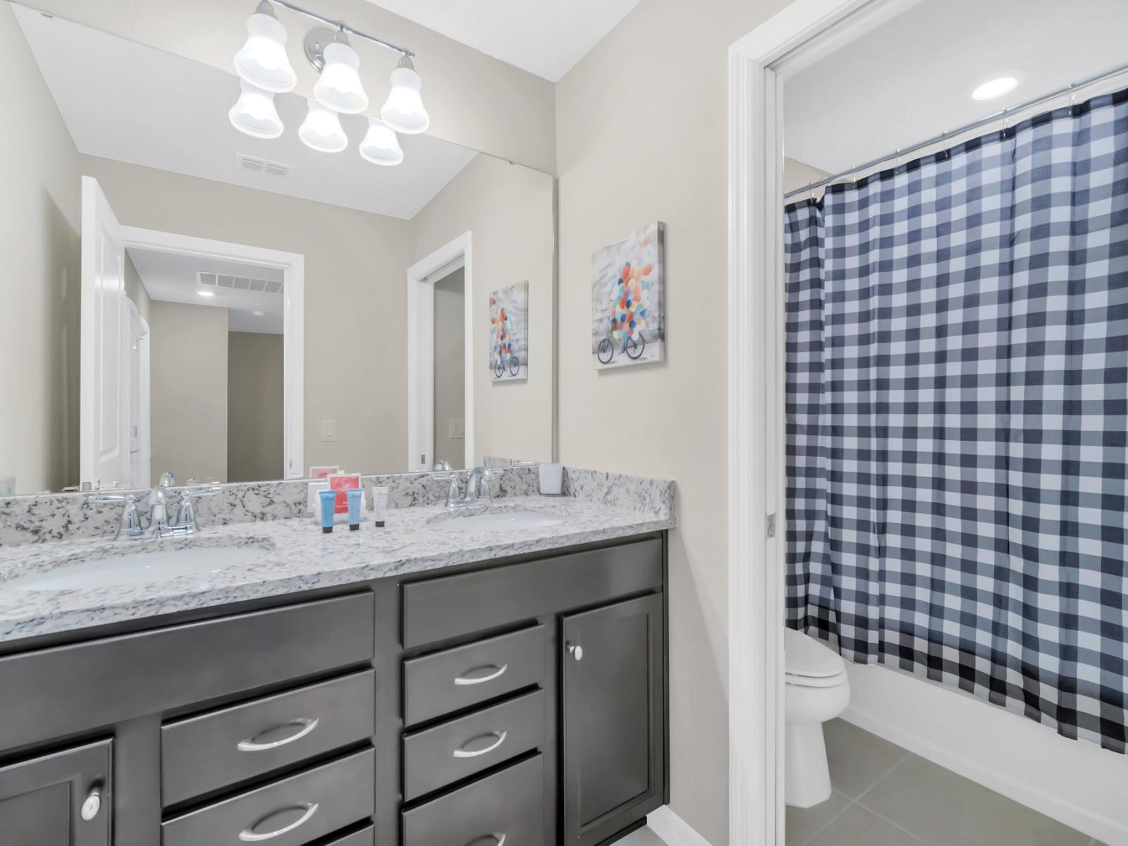 Elegant bathroom of the townhouse in Polk County, Florida - Features twin sinks for enhanced functionality - Subtle sophistication with sleek lines and exquisite detailing - This bathroom enveloped in a serene color palette for utmost tranquility