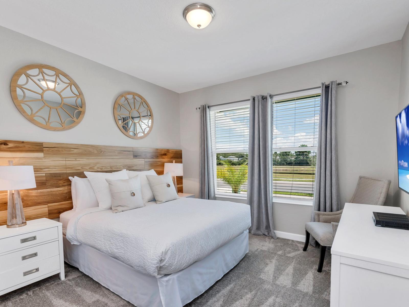 Charming bedroom of the home in Kissimmee Florida - Cozy retreat with a plush double bed, perfect for relaxation - Stunning views from the bedroom window - Smart TV to watch your favorite shows or movie