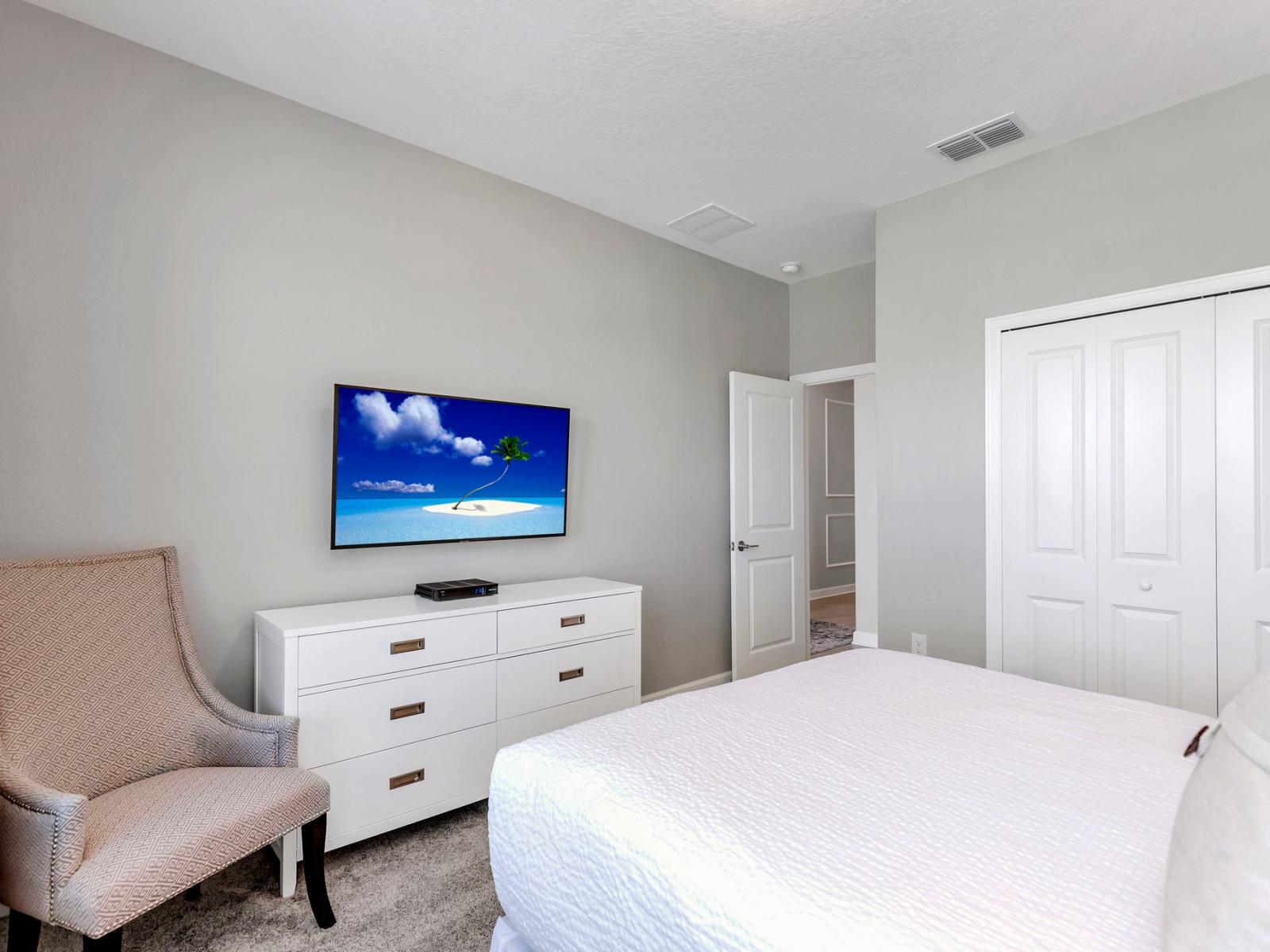 City Chic: Our bedroom with a Smart TV is a stylish urban escape, where sleek design and intelligent technology come together for a perfect stay