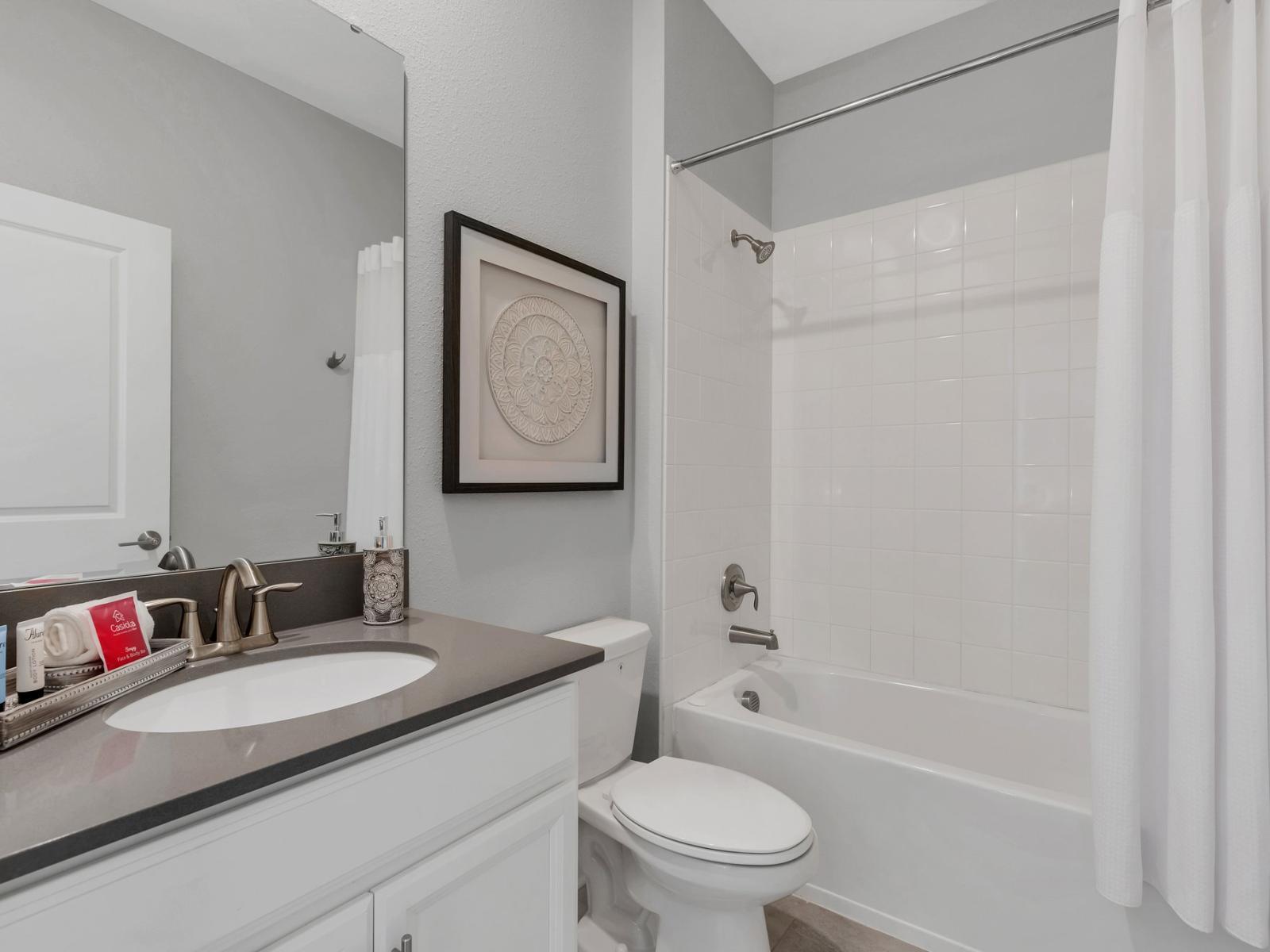 Modern Retreat: Relax in sophistication within our contemporary bathroom, featuring sleek design elements that transform it into your personal sanctuary for rejuvenation.