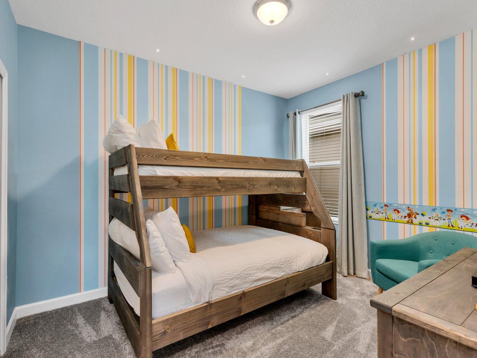 Relaxing bedroom of the home in Kissimmee Florida - Toy Story themed bedroom offering a bunk bed with a double bed and a single bed on top - Thoughtfully designed for comfort and style - Intimate space with a touch of sophistication